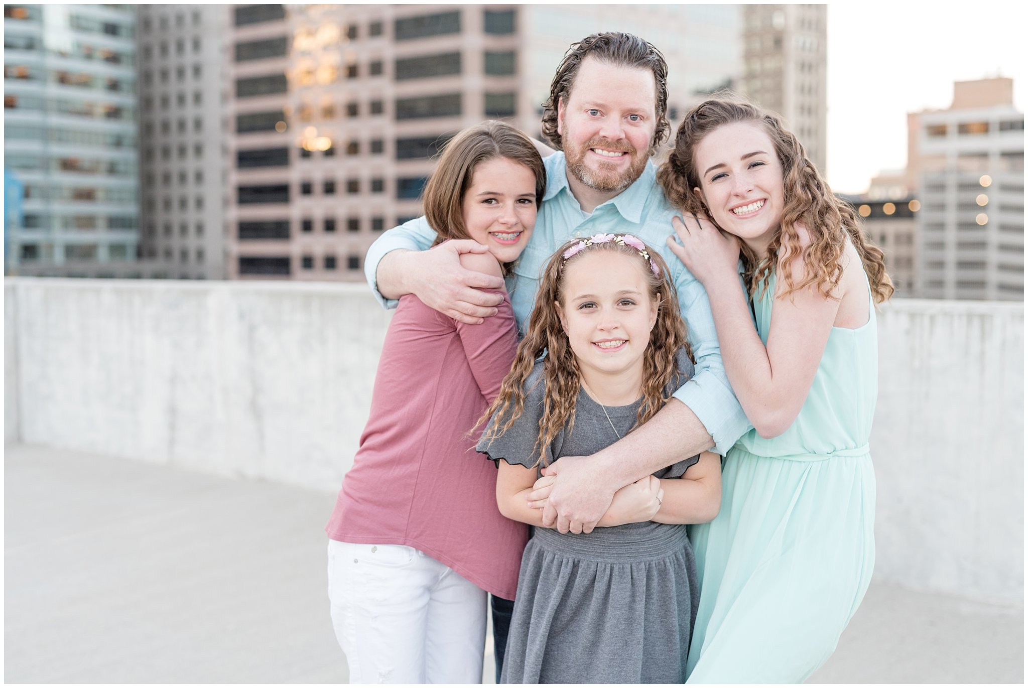 Downtown Salt Lake urban family session | Dad and daughters on rooftop