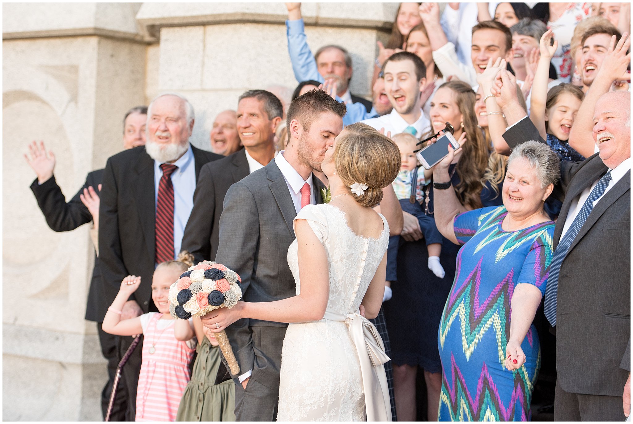 Salt Lake Temple candid group pictures | Coral and grey spring wedding