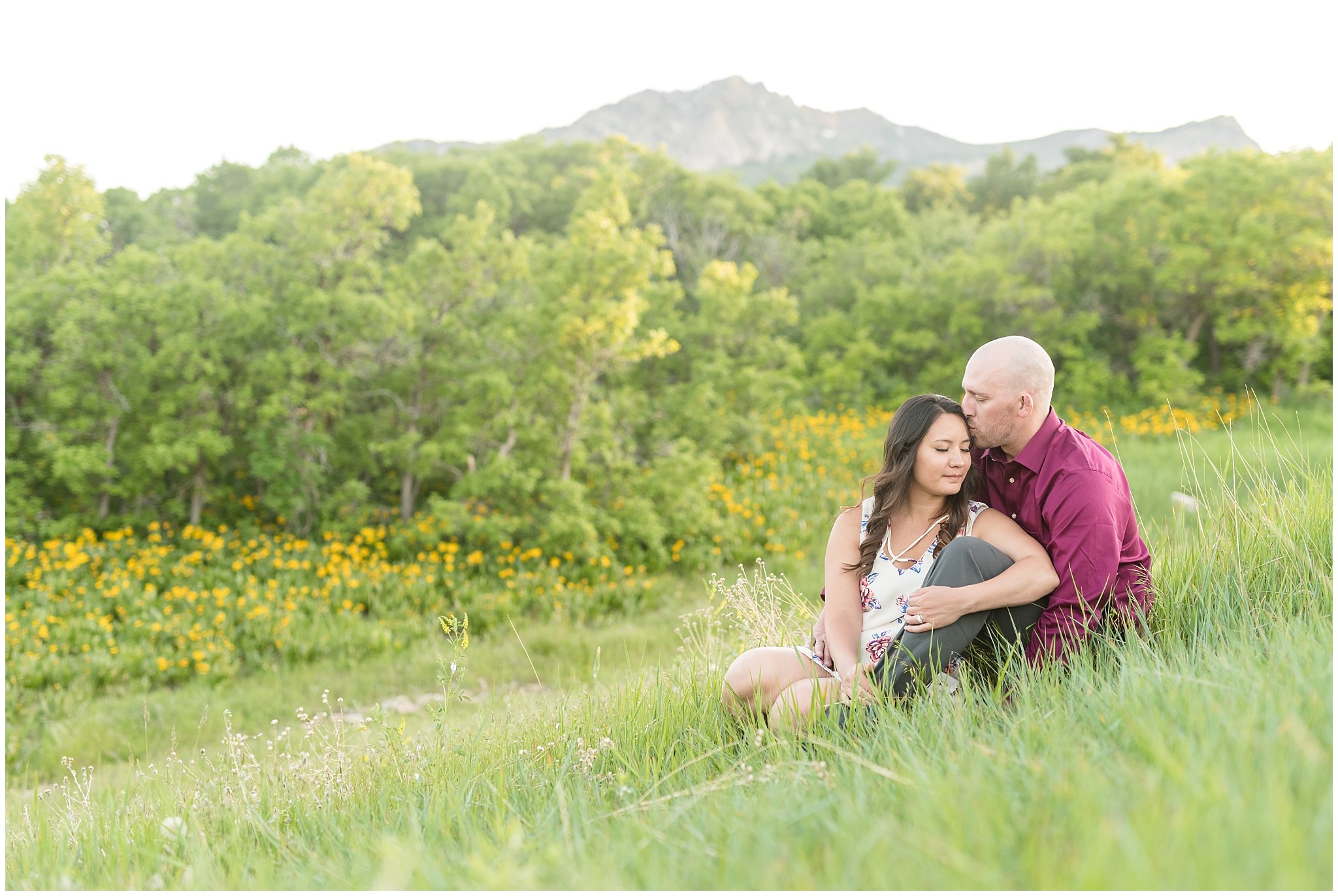 Engagement session with mountains in the background and wildflowers | Snowbasin Utah Engagements