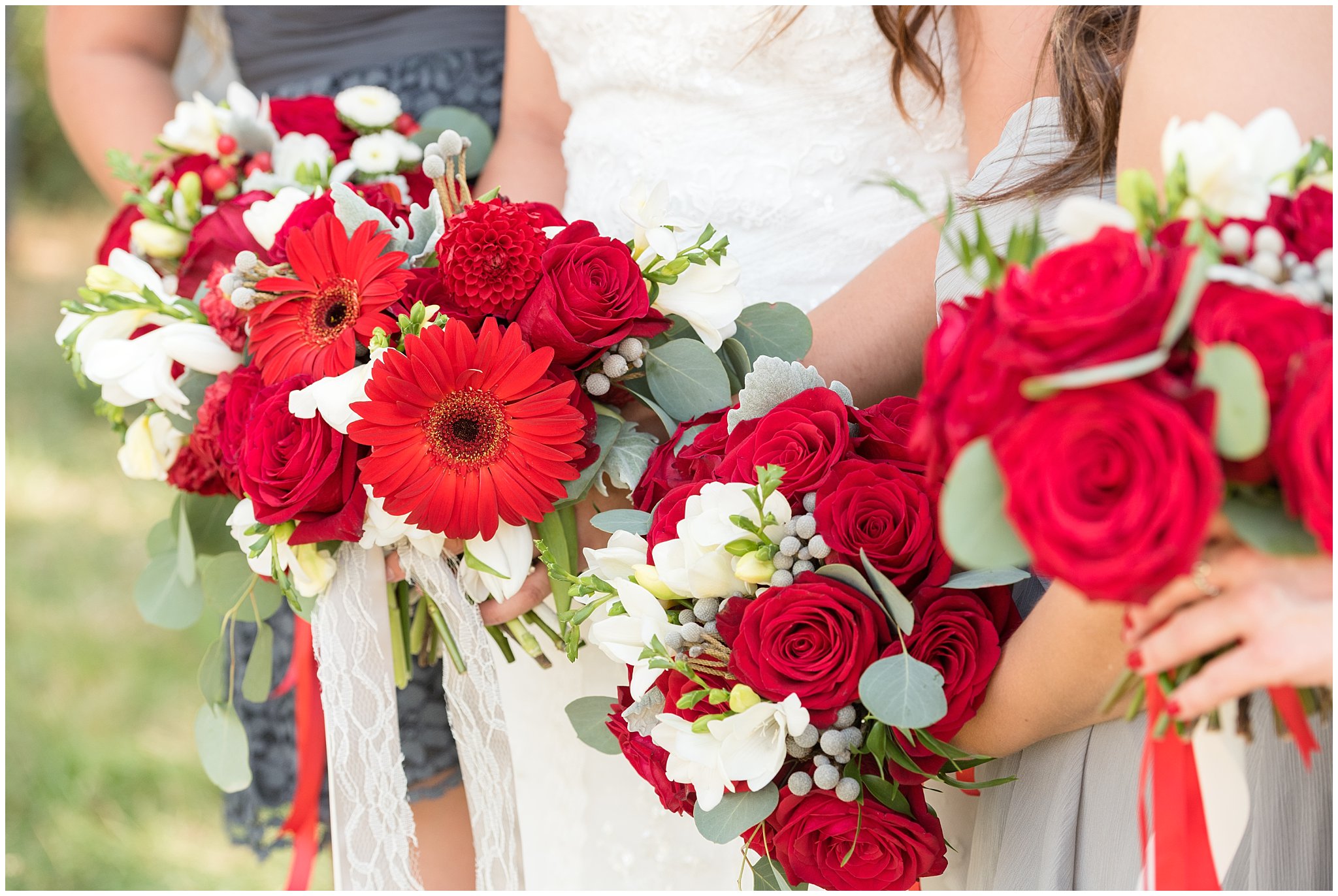 Dancing Daisies Floral | Detail and close up of bride and bridesmaid's red and white wedding bouquets | Davis County Outdoor Wedding | Jessie and Dallin Photography