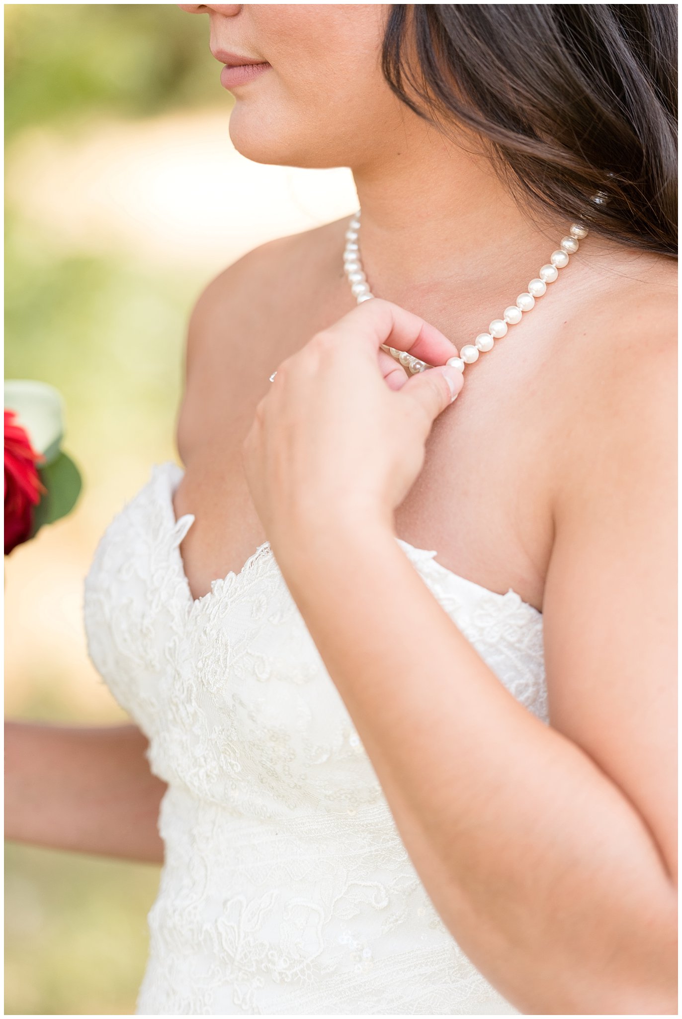 Bride holding grandmother's pearls that are a family heirloom | Davis County Outdoor Wedding | Jessie and Dallin Photography