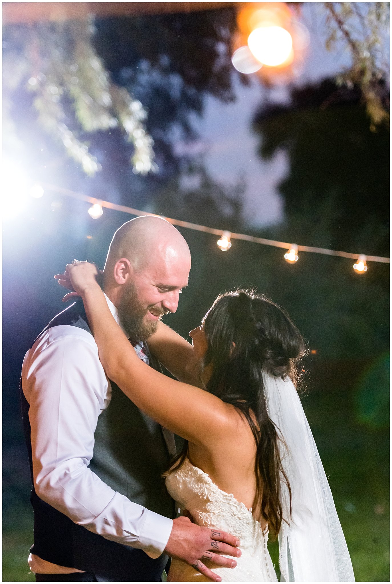 Bride and Groom smiling during outdoor first dance | Red and Grey wedding | Davis County Outdoor Wedding | Jessie and Dallin Photography