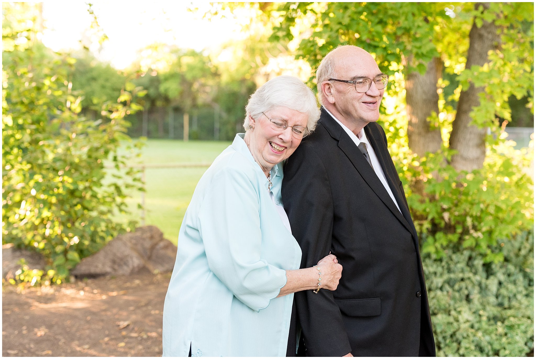 Grandparents laughing during pictures | Layton Commons Park | Layton Couples Photographer | Jessie and Dallin