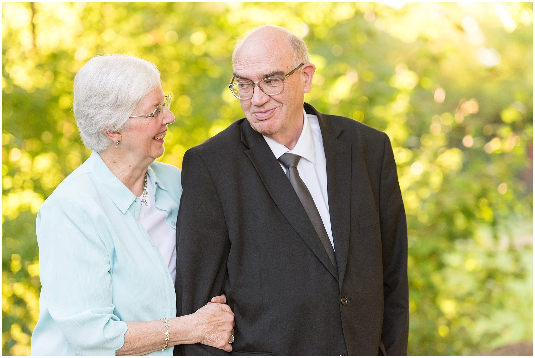 Grandparents looking and smiling at each other | Layton Commons Park | Layton Couples Photographer | Jessie and Dallin
