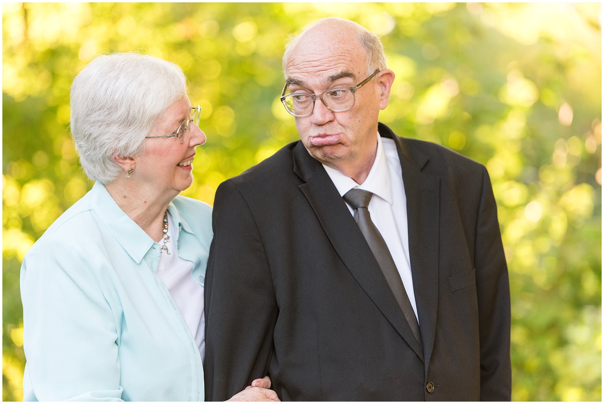 Grandpa making funny faces at grandma | Layton Commons Park | Layton Couples Photographer | Jessie and Dallin