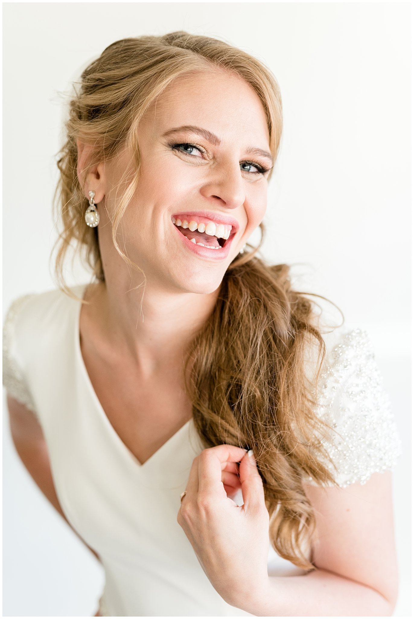 Laughing bride during bridals at Talia Event Center | Why Hire a professional hair and makeup artist | Jessie and Dallin Photography