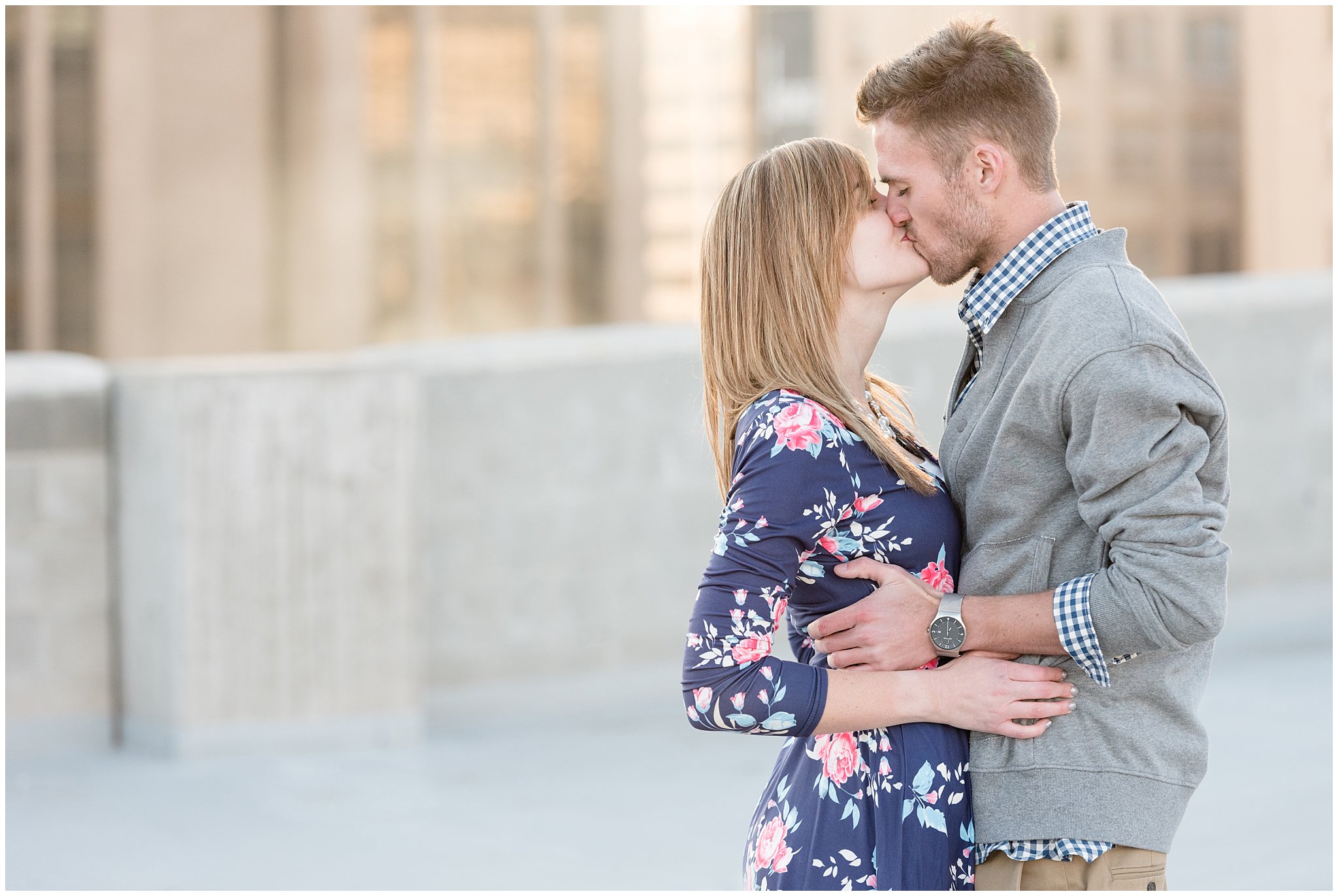Couple kisses on rooftop in Salt Lake | Here’s 3 Reasons Why You Need an Engagement Session | Utah Wedding Photographers | Jessie and Dallin Photography