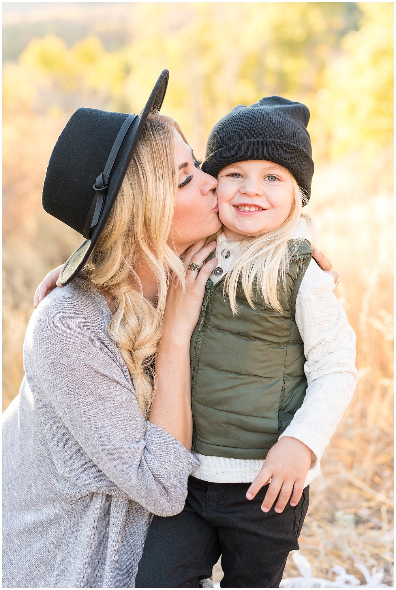 Mom kissing son on the cheek in the mountains | Fall Family Pictures in the Mountains | Snowbasin, Utah | Jessie and Dallin