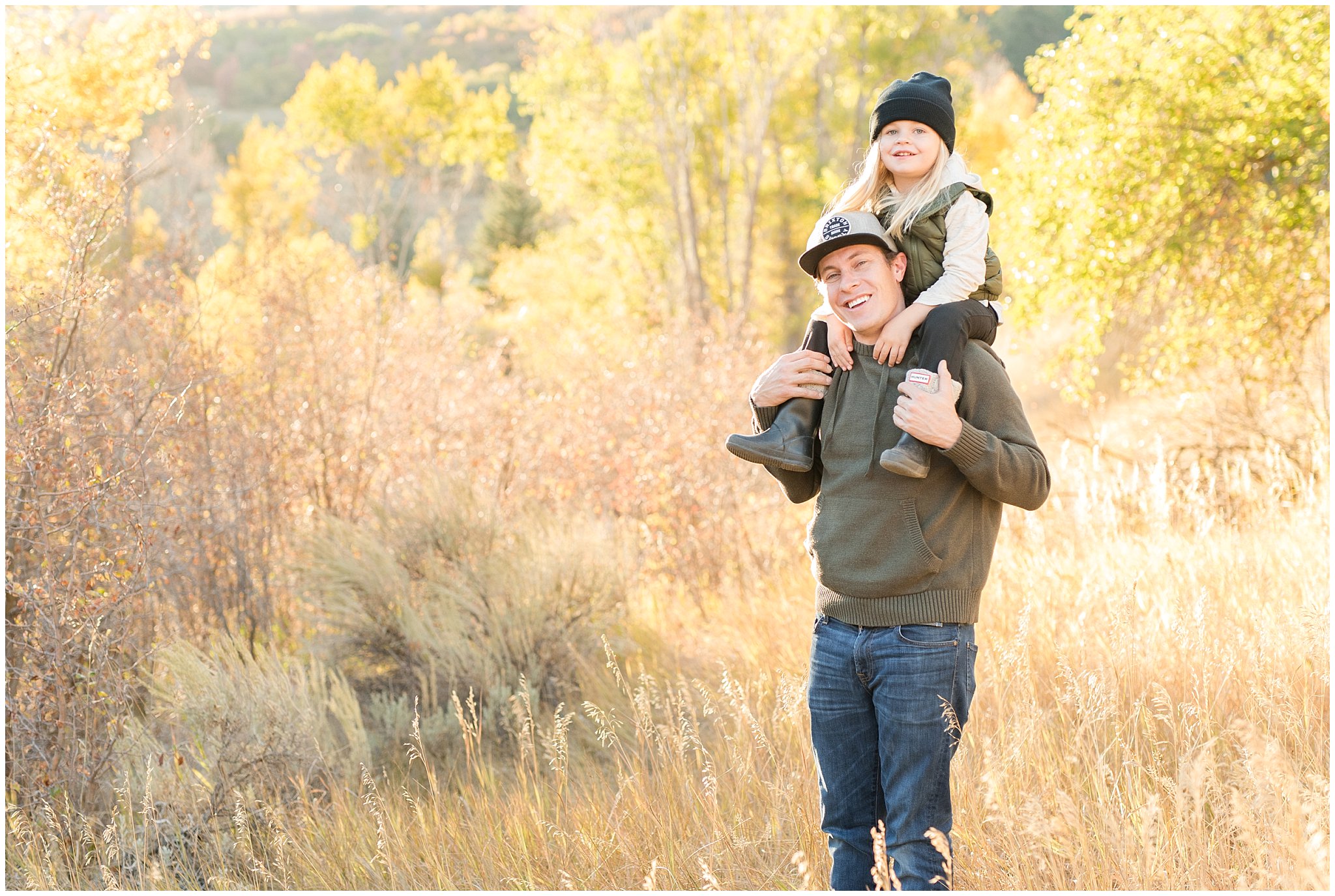 Dad giving son a piggy back ride with the fall colors | Fall Family Pictures in the Mountains | Snowbasin, Utah | Jessie and Dallin