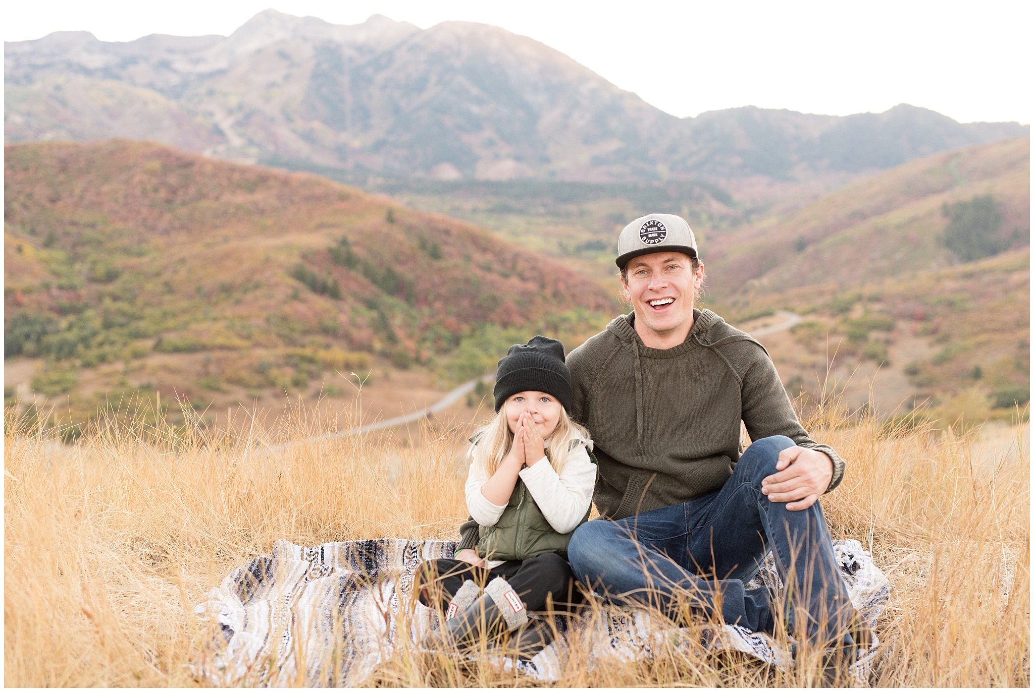 Father and son laughing with view of the mountains | Fall Family Pictures in the Mountains | Snowbasin, Utah | Jessie and Dallin
