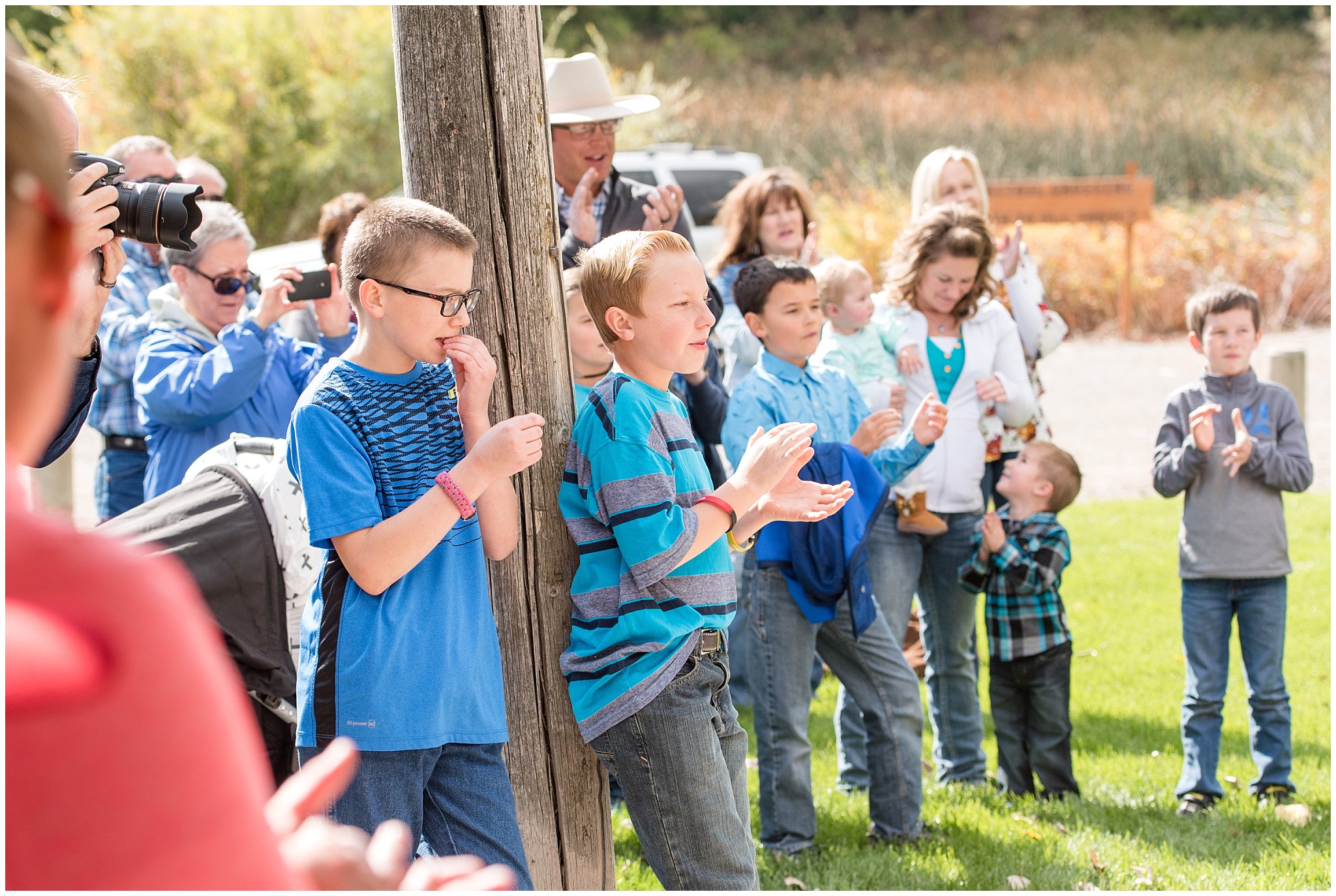 Family cheering after wish is revealed | Tremonton Family Pictures and Make a Wish Event | Jessie and Dallin Photography