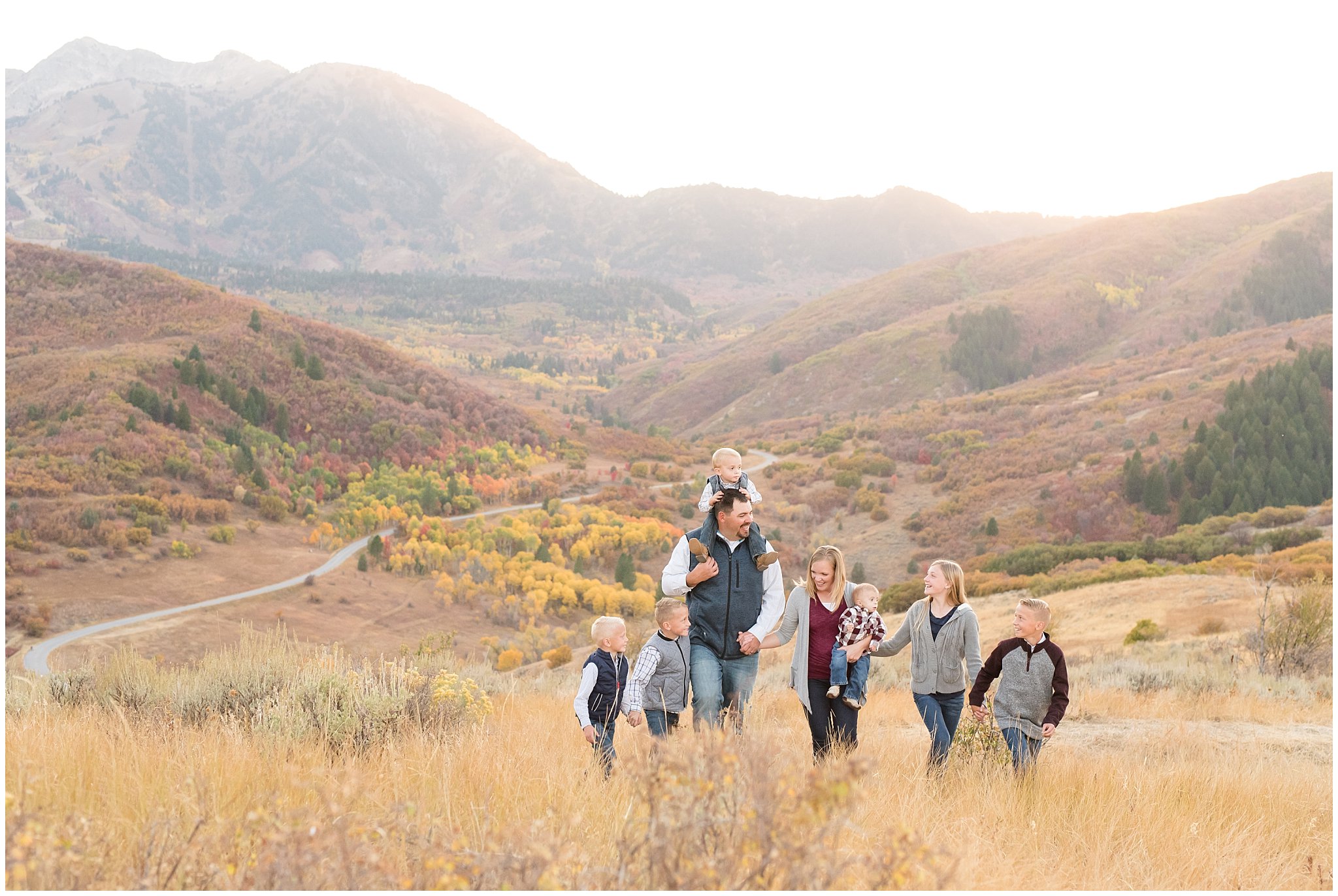 Family with 6 kids walking in the fall mountains | Fall family photo session at Snowbasin | Snowbasin Resort | Jessie and Dallin Photography