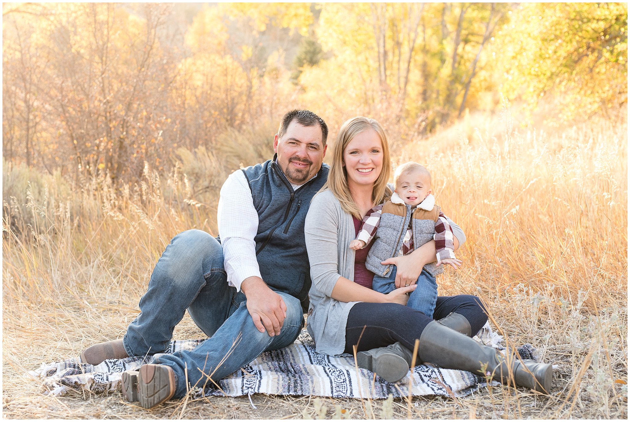 Mom, Dad and infant in the fall leaves | Fall family photo session at Snowbasin | Snowbasin Resort | Jessie and Dallin Photography