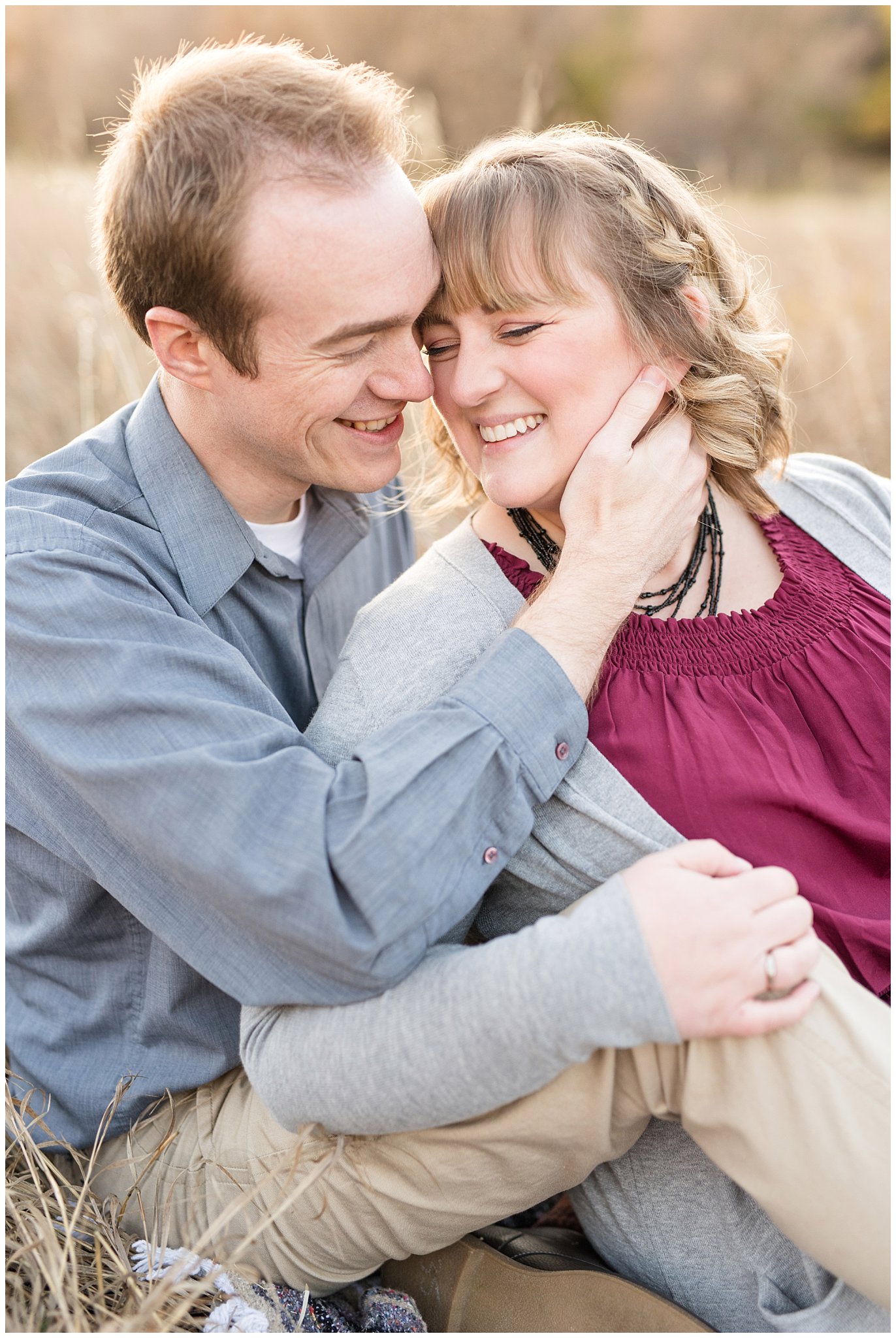 Couple laughing close together in a field | Davis County Fall Engagement | Utah Wedding Photographers | Jessie and Dallin