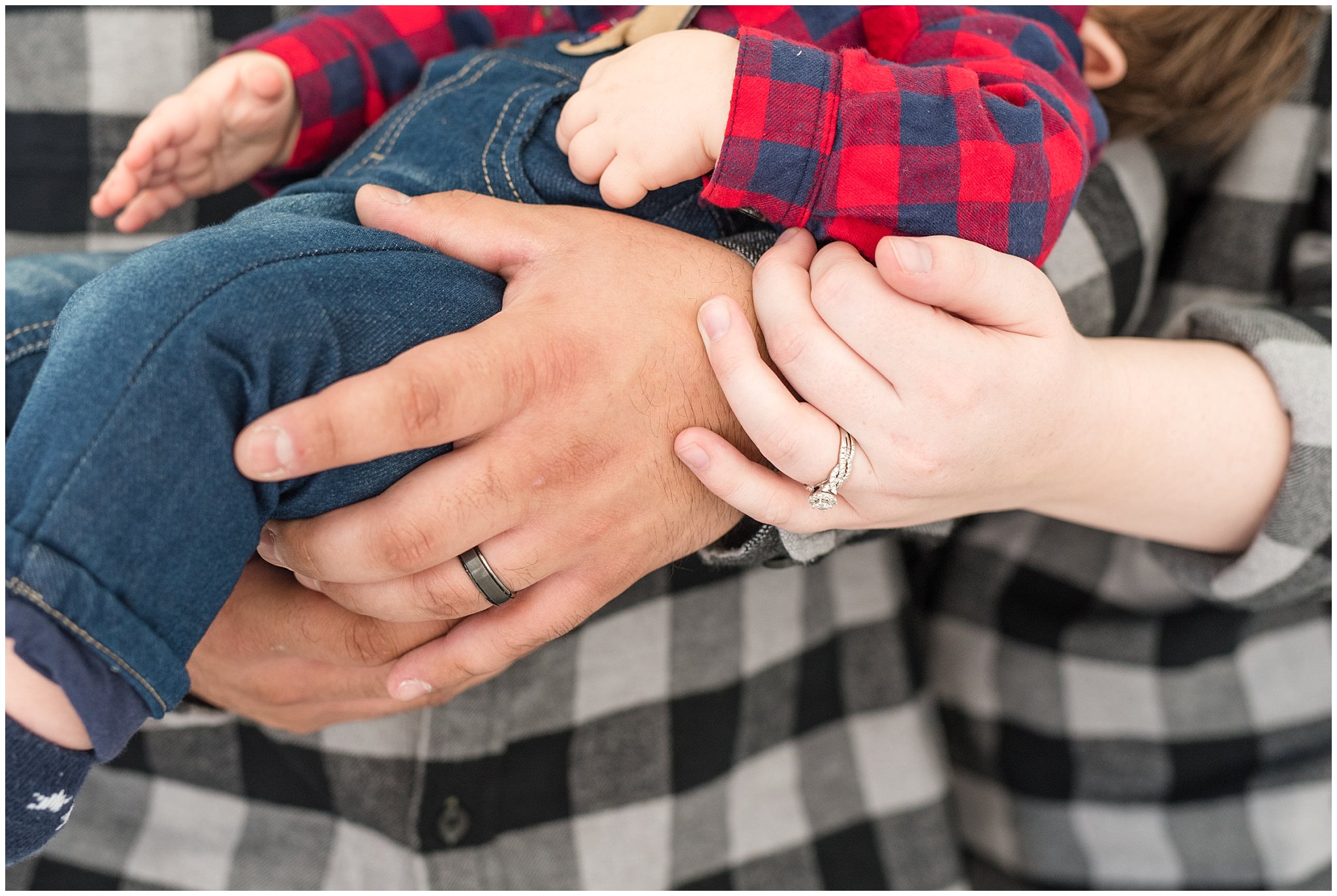 Parents hands detail shot holding baby | Family Christmas session at the 5th floor | Utah Photographers | Jessie and Dallin Photography