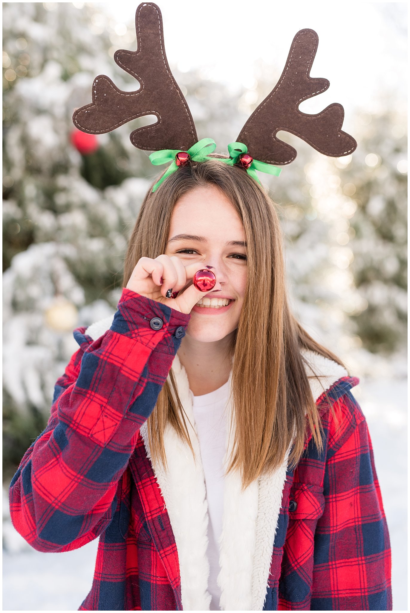 Teenage girl with rudolph nose and reindeer antlers | Utah Family Christmas Photoshoot | Oak Hills Reception and Event | Jessie and Dallin Photography