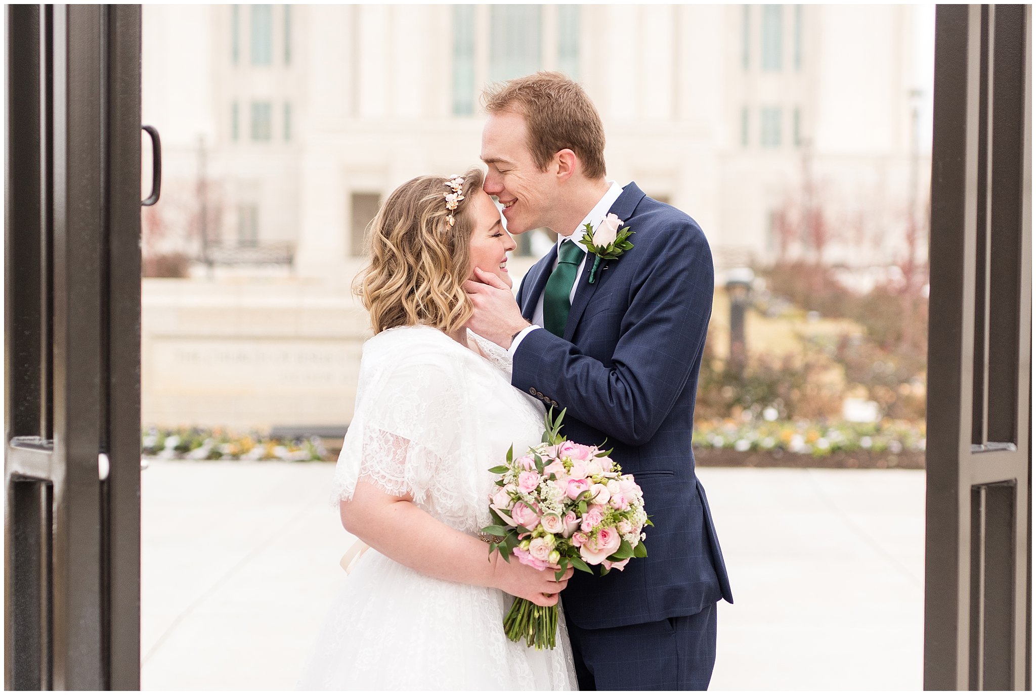 Groom kisses bride at Ogden temple gate | Ogden Temple Winter Wedding | Emerald Green and Pink Wedding | Jessie and Dallin Photography