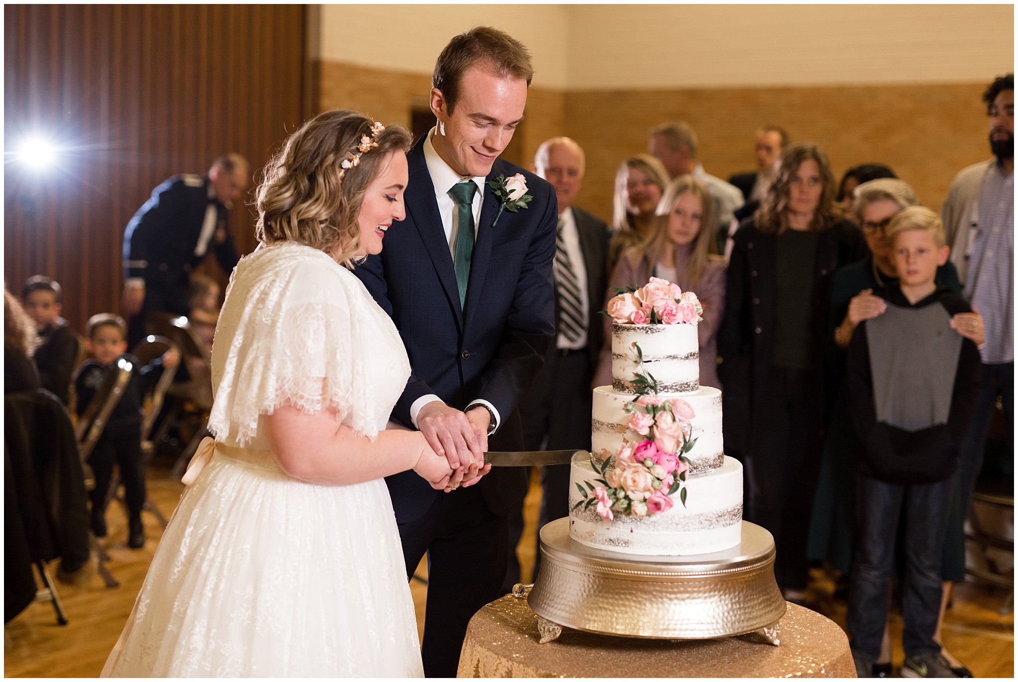 Bride and groom cutting wedding cake | Ogden Temple Winter Wedding | Emerald Green and Pink Wedding | Jessie and Dallin Photography
