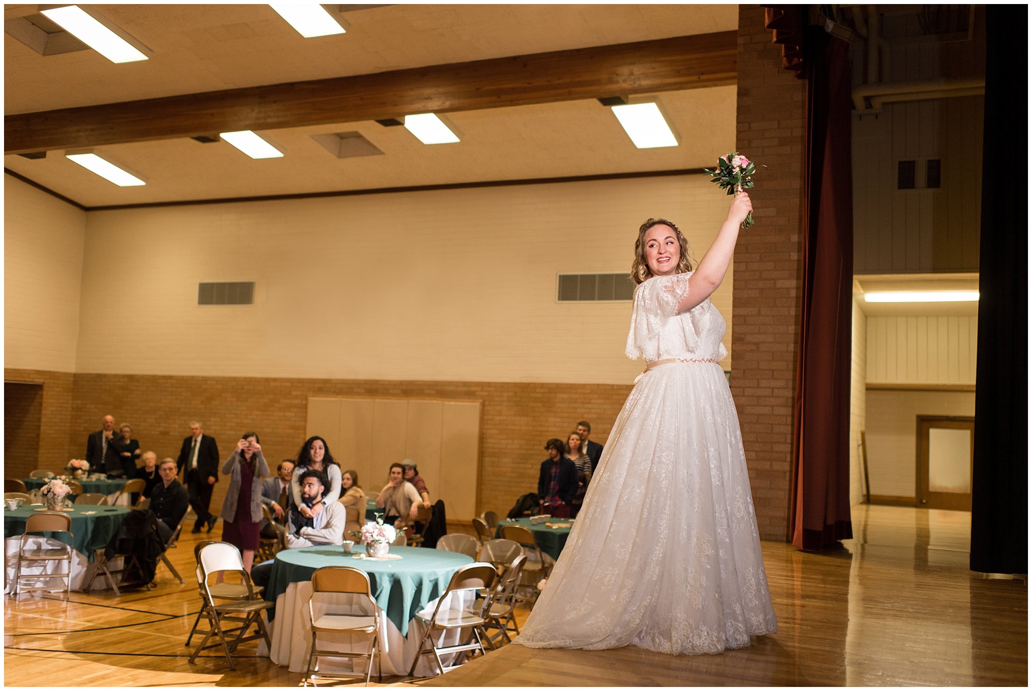 Bride tossing bouquet off stage | Ogden Temple Winter Wedding | Emerald Green and Pink Wedding | Jessie and Dallin Photography