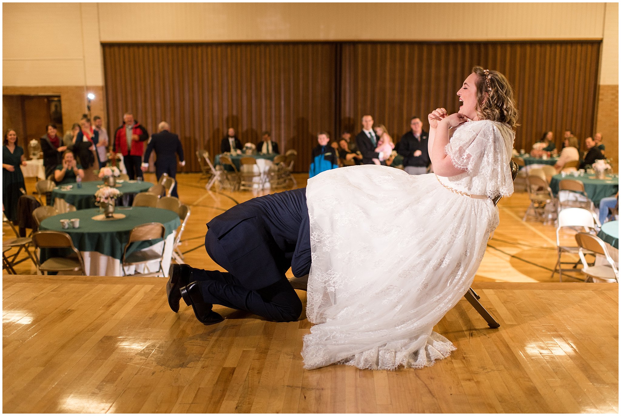 Groom gets garter for garter toss | Ogden Temple Winter Wedding | Emerald Green and Pink Wedding | Jessie and Dallin Photography
