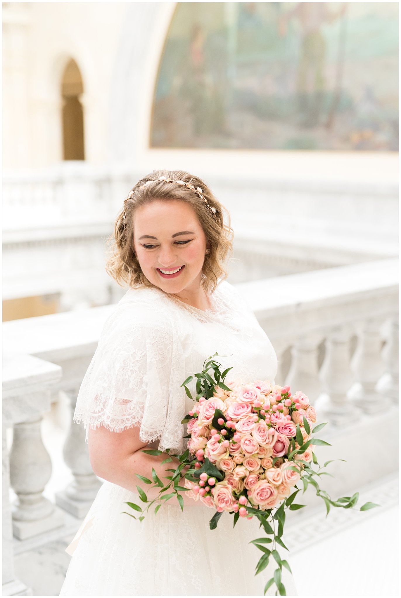 Bride laughing and holding bouquet in capitol building | Winter Formals at the Utah State Capitol | Utah Wedding Photography