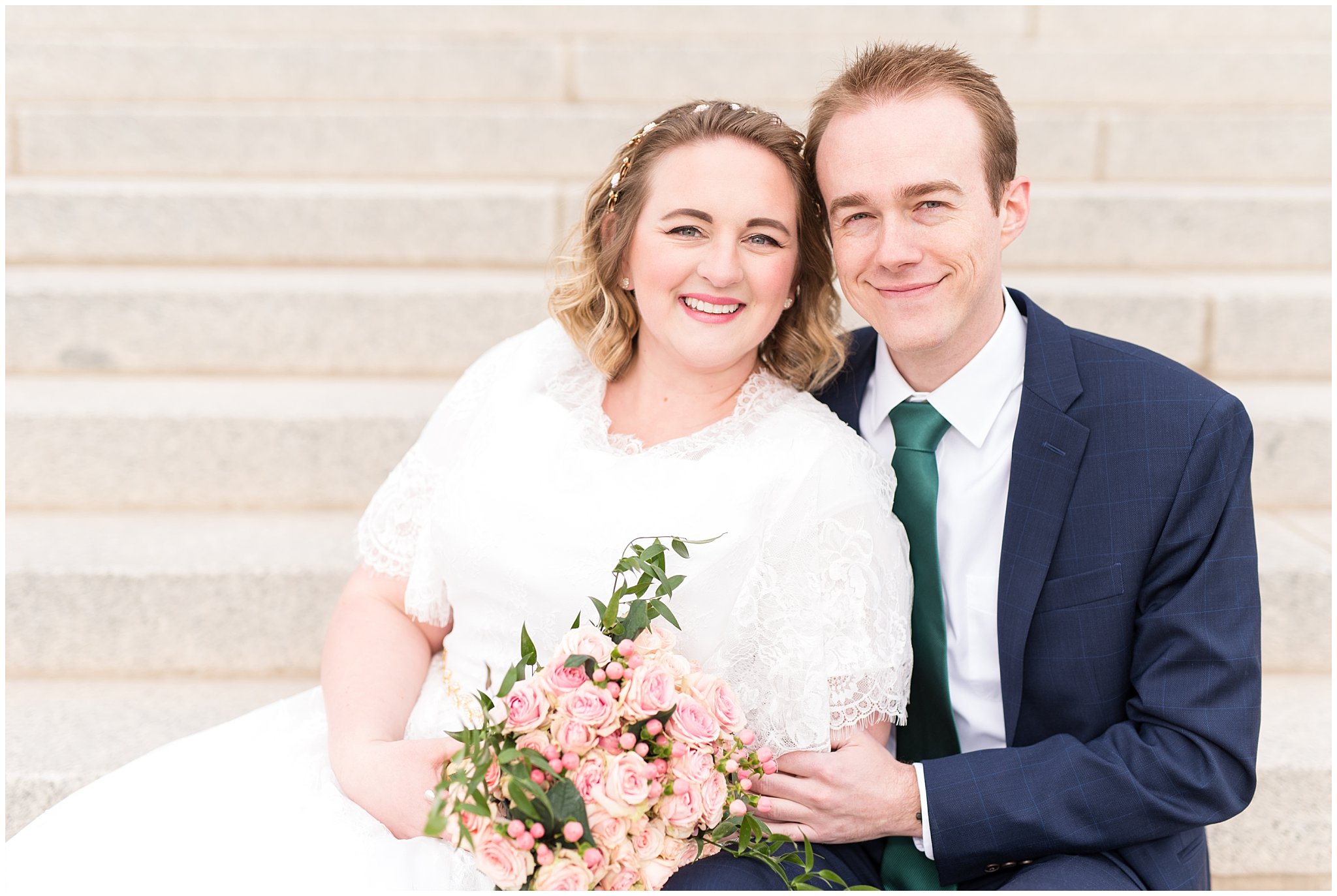 Bride and groom smiling at the camera sitting on steps | Winter Formals at the Utah State Capitol | Utah Wedding Photography
