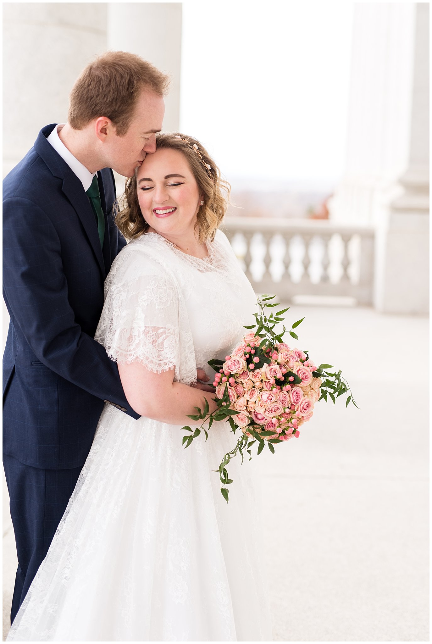 Bride and groom next to capitol columns | Winter Formals at the Utah State Capitol | Utah Wedding Photography