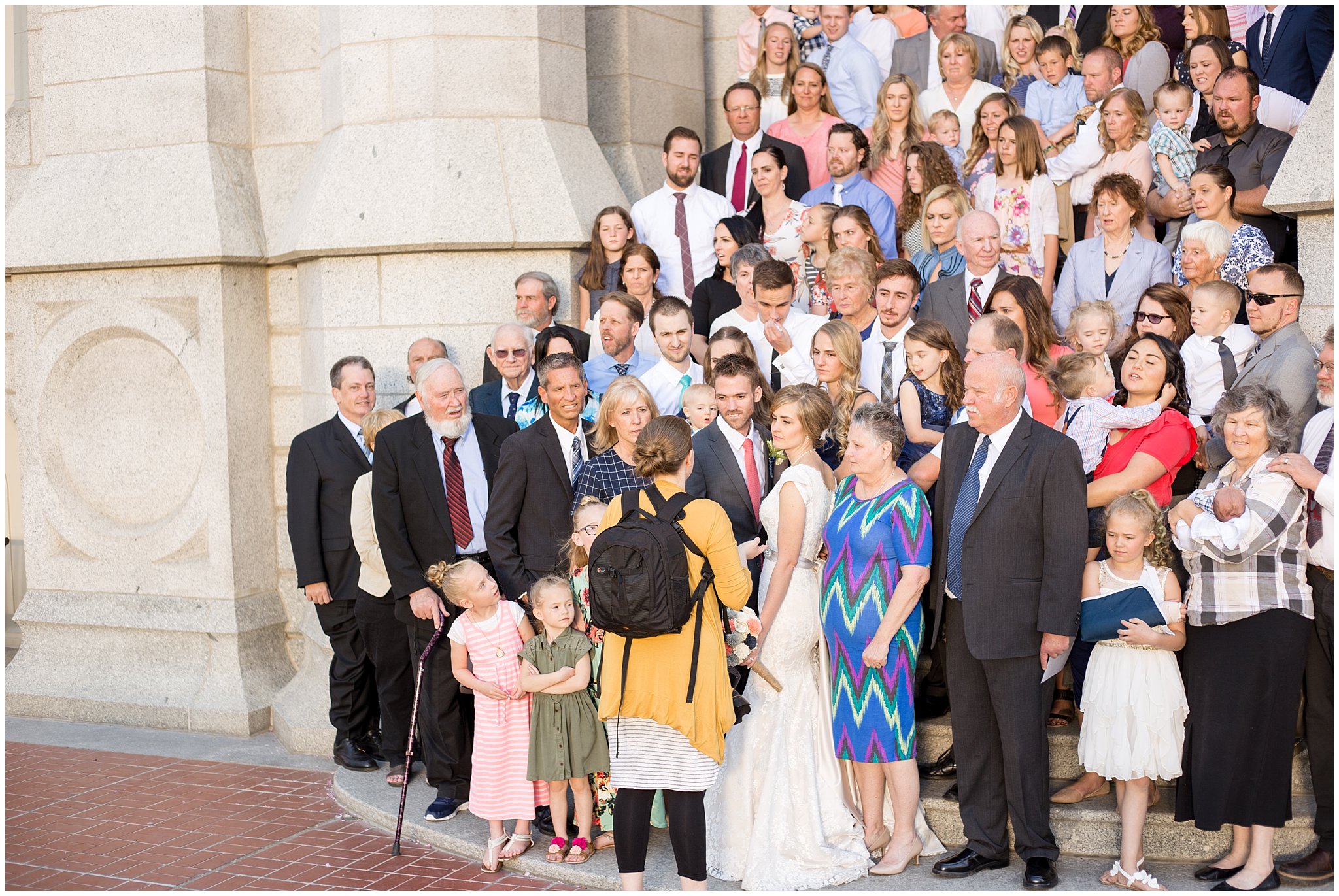 Utah Photographers outside of Salt Lake temple with family | Husband and Wife Photography Team | Jessie and Dallin Photography