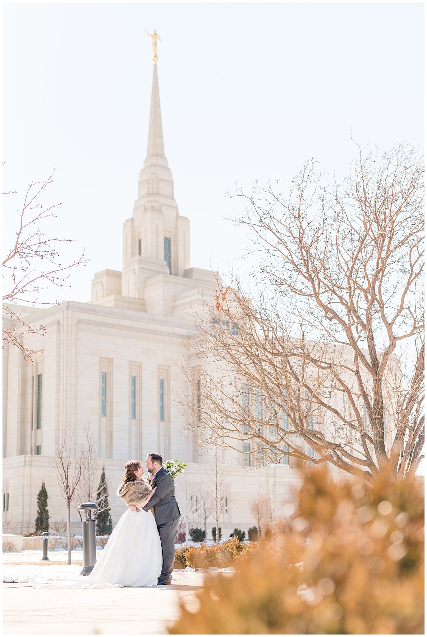 Bride and groom laughing in front of the temple | Ogden Temple Wedding | Jessie and Dallin Photography