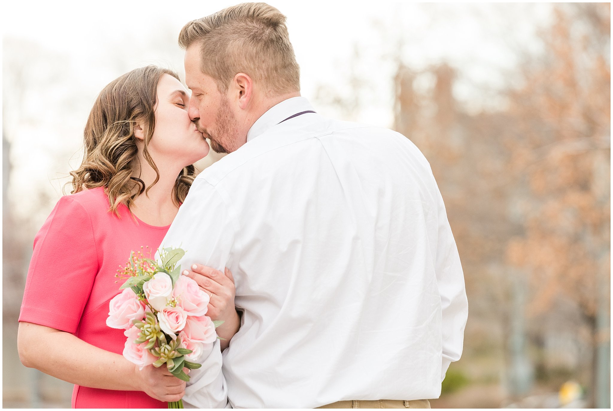 Couple kisses on pedestal at Salt Lake Temple | Salt Lake Temple Sealing | Jessie and Dallin Photography