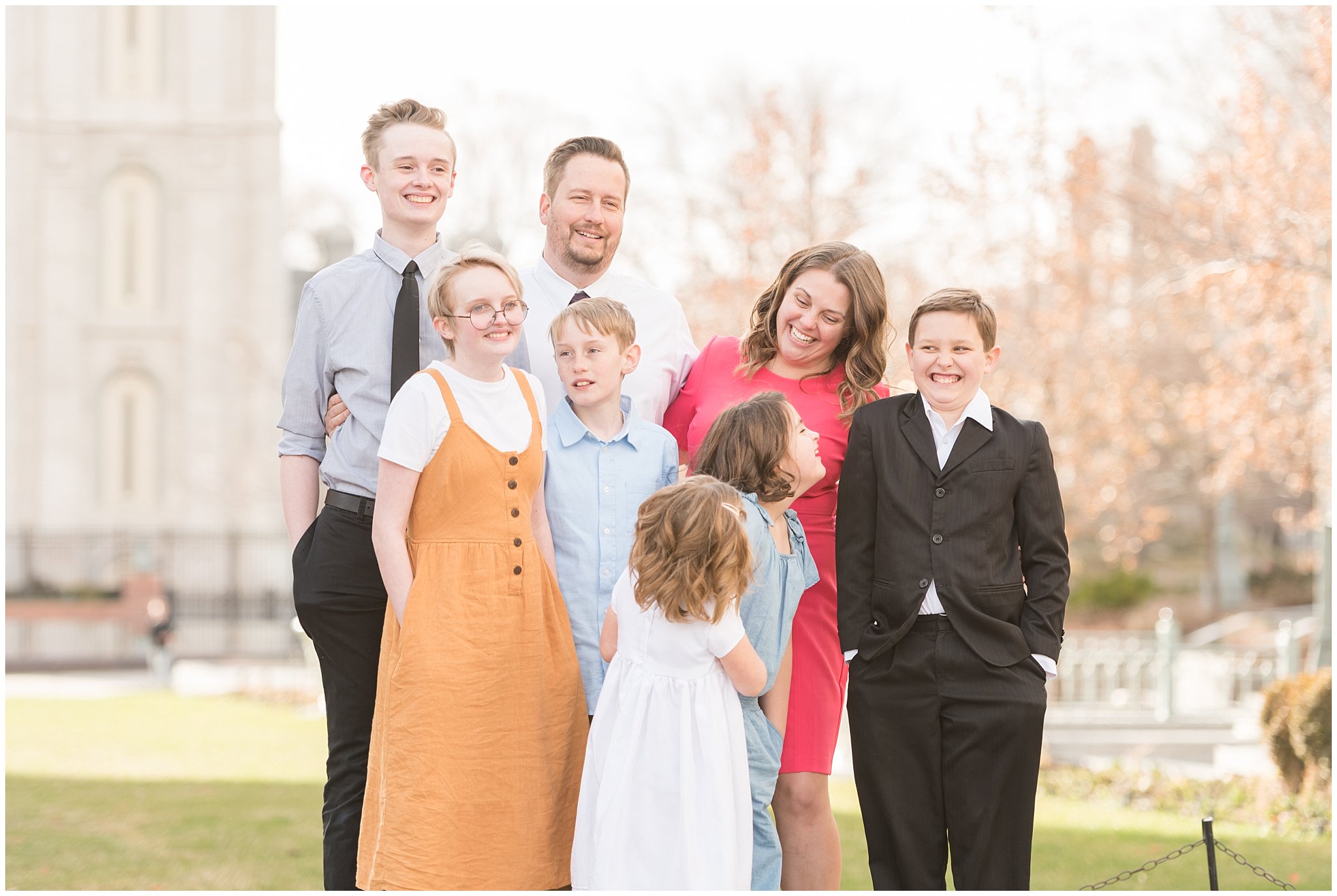 Family standing on pedestal and laughing together | Salt Lake Temple Sealing | Jessie and Dallin Photography