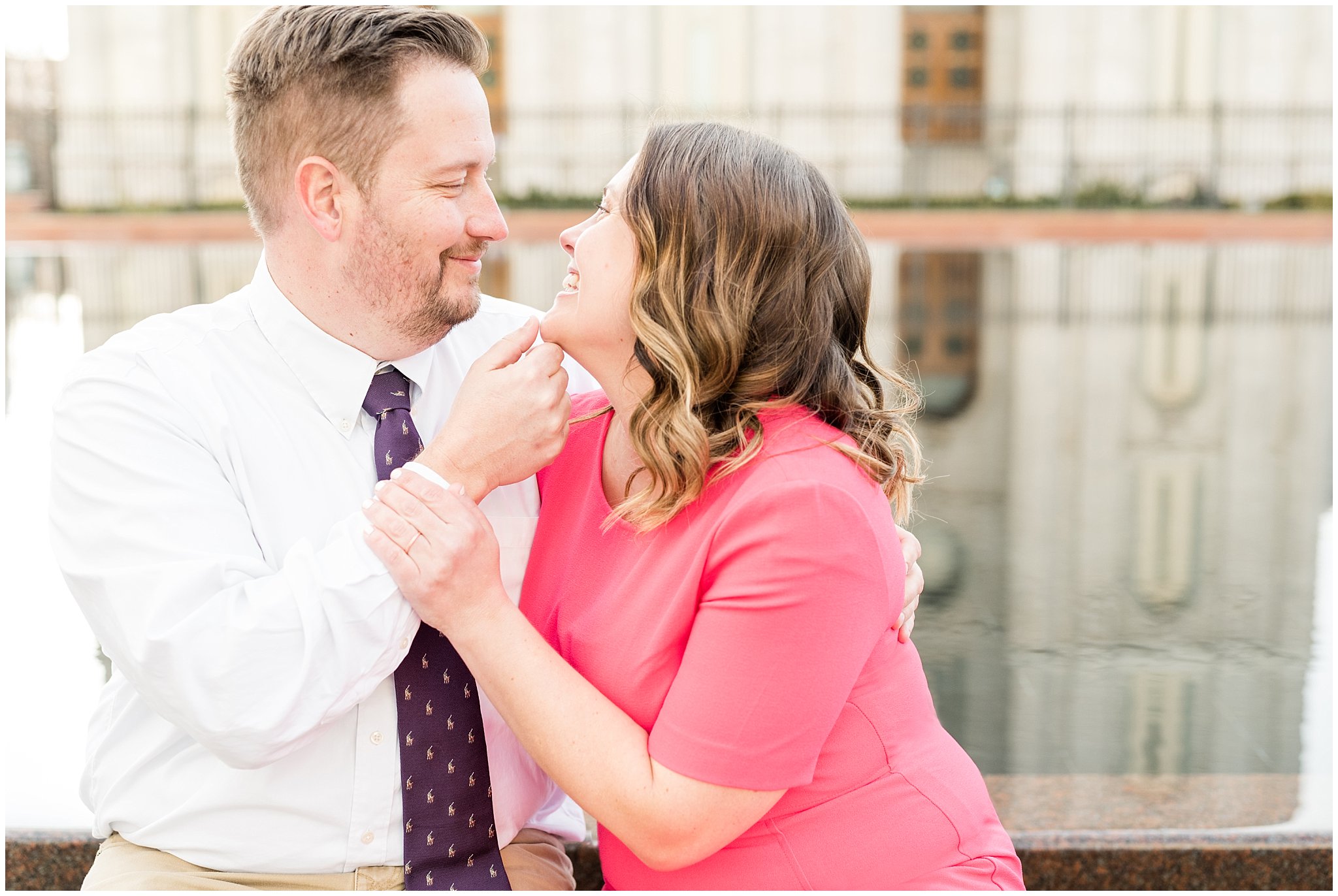 Couple laughing after a kiss at the reflection pool at the Salt Lake Temple | Salt Lake Temple Sealing | Jessie and Dallin Photography