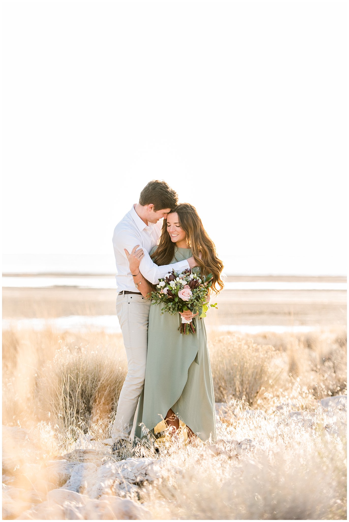 Couple dressed up for Antelope Island Engagement with bouquet | Antelope Island Engagements | Utah Wedding Photographers | Jessie and Dallin Photography