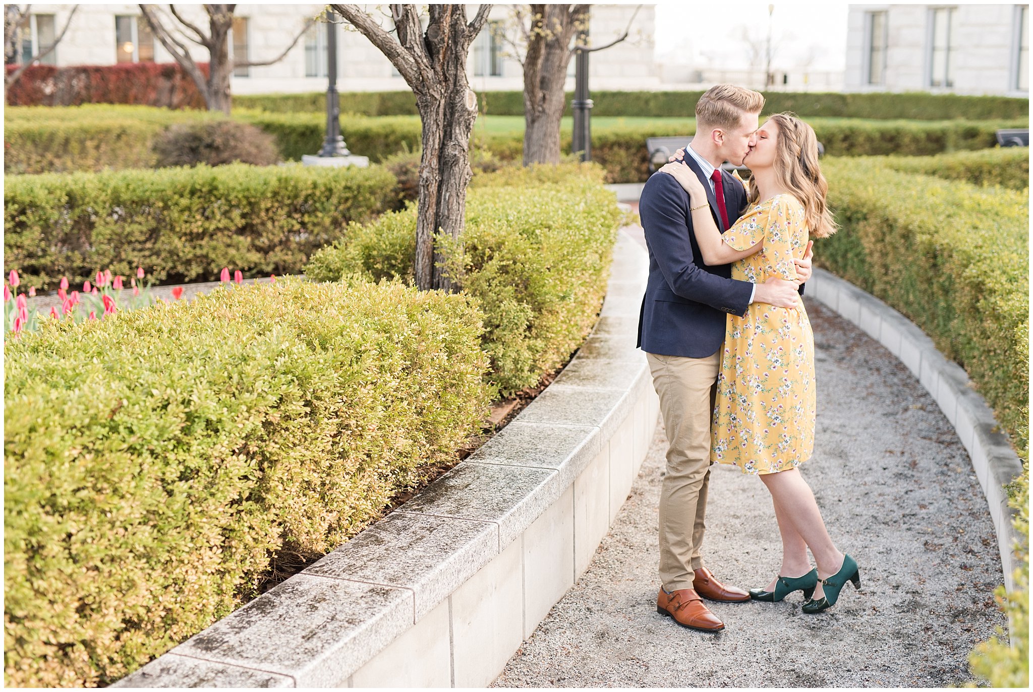 Couple dressed up in suit and yellow dress at the Utah State Capitol in the spring | Spring Blossom Engagement at the Utah State Capitol | Utah Wedding Photographers | Jessie and Dallin