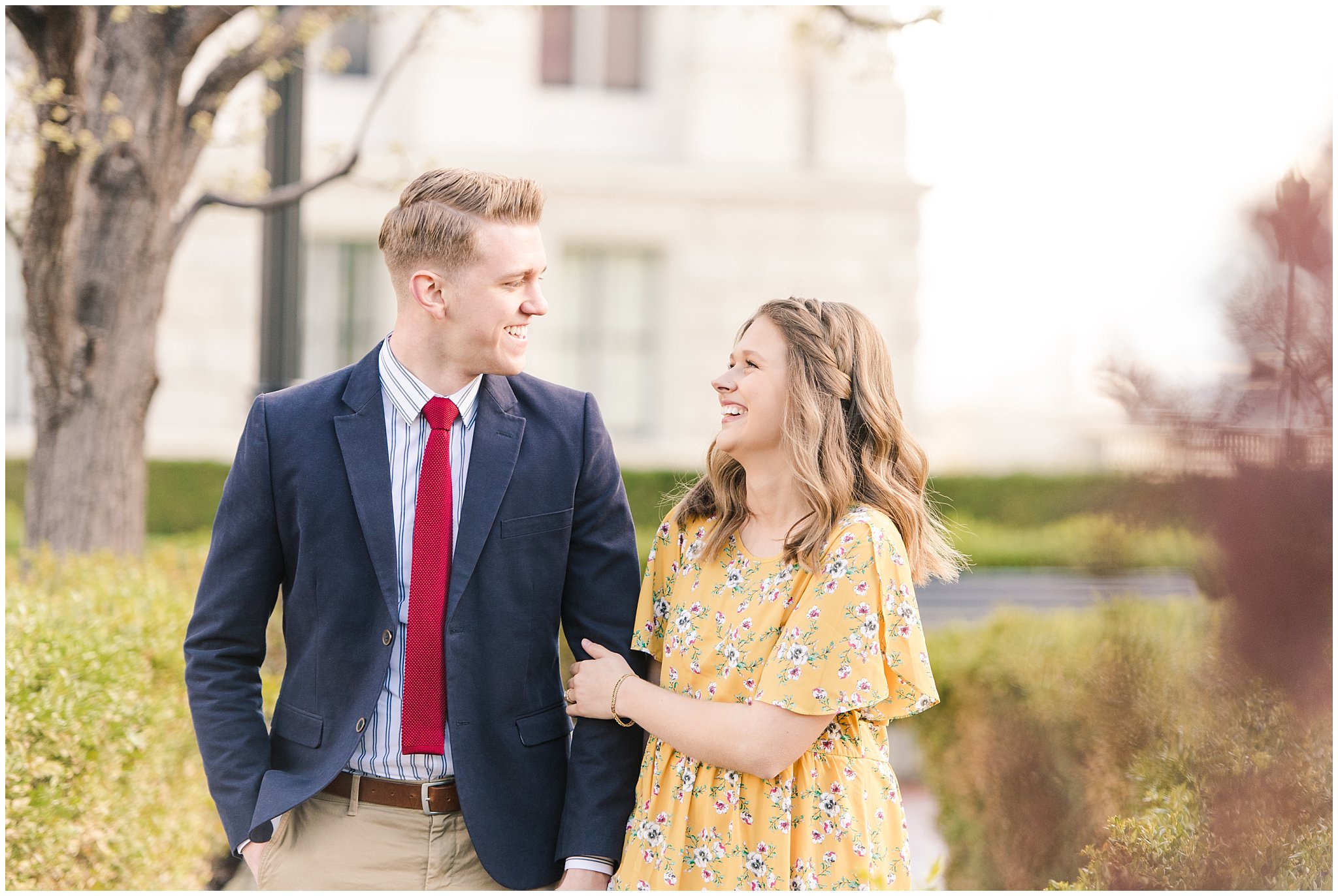 Couple dressed up in suit and yellow dress at the Utah State Capitol in the spring | Spring Blossom Engagement at the Utah State Capitol | Utah Wedding Photographers | Jessie and Dallin