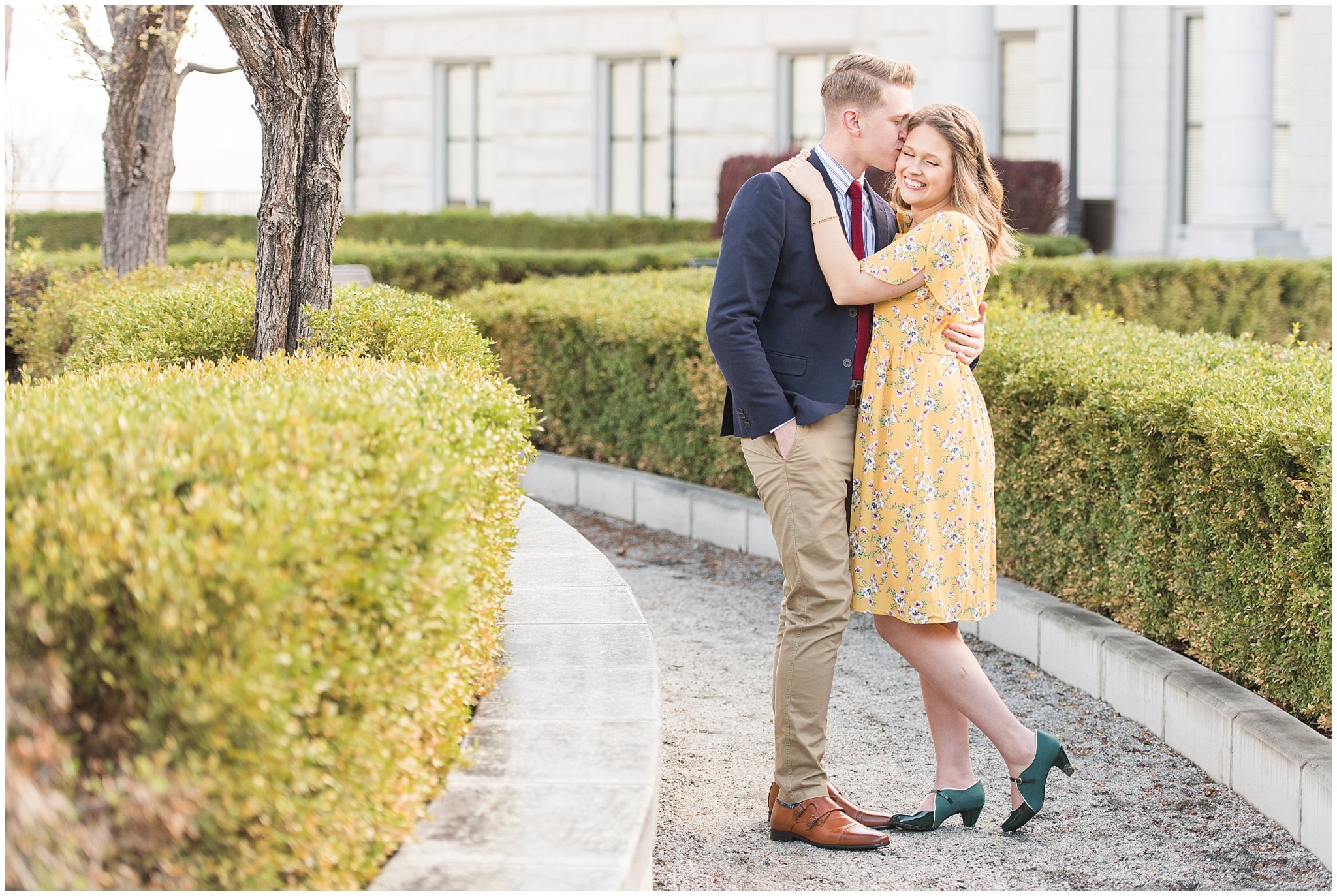 Couple dressed up in suit and yellow dress at the Utah State Capitol in the spring | Spring Blossom Engagement at the Utah State Capitol | Utah Wedding Photographers | Jessie and Dallin