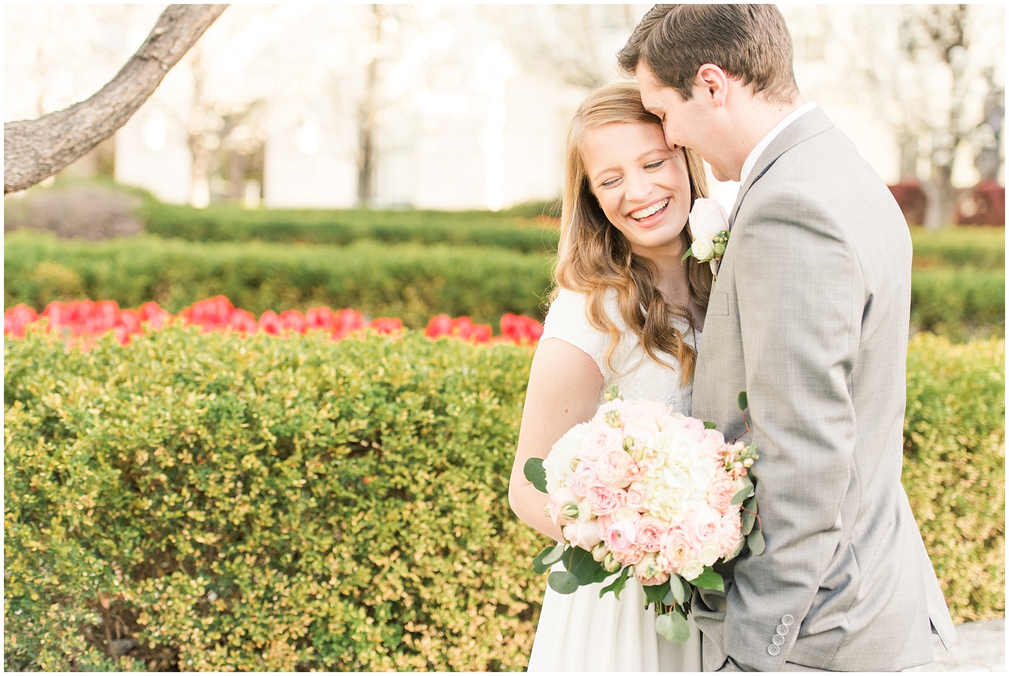 Bride with blush bouquet and groom with grey suit in the blossoms | Utah State Capitol Blossoms Formal Session | Salt Lake Wedding Photographers | Jessie and Dallin Photography