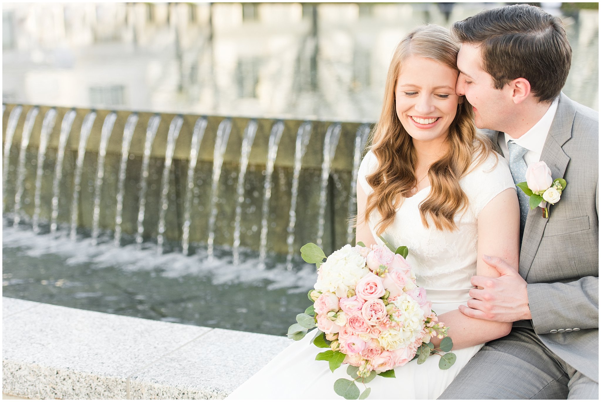 Bride with blush bouquet and groom with grey suit by capitol reflection pool | Utah State Capitol Blossoms Formal Session | Salt Lake Wedding Photographers | Jessie and Dallin Photography