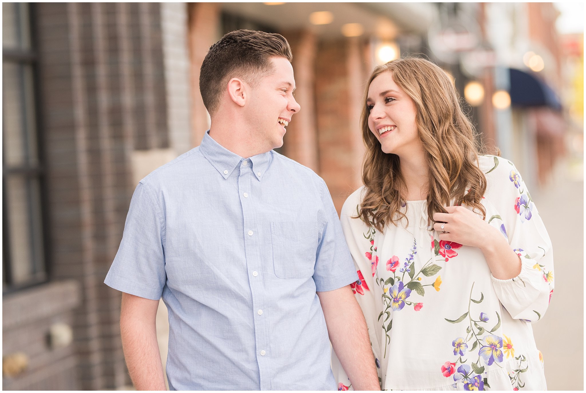 Couple dressed in elegant, light, neutral colors for downtown urban engagement in Logan Utah | Downtown Logan and Wellsville Mountain Engagement | Jessie and Dallin Photography