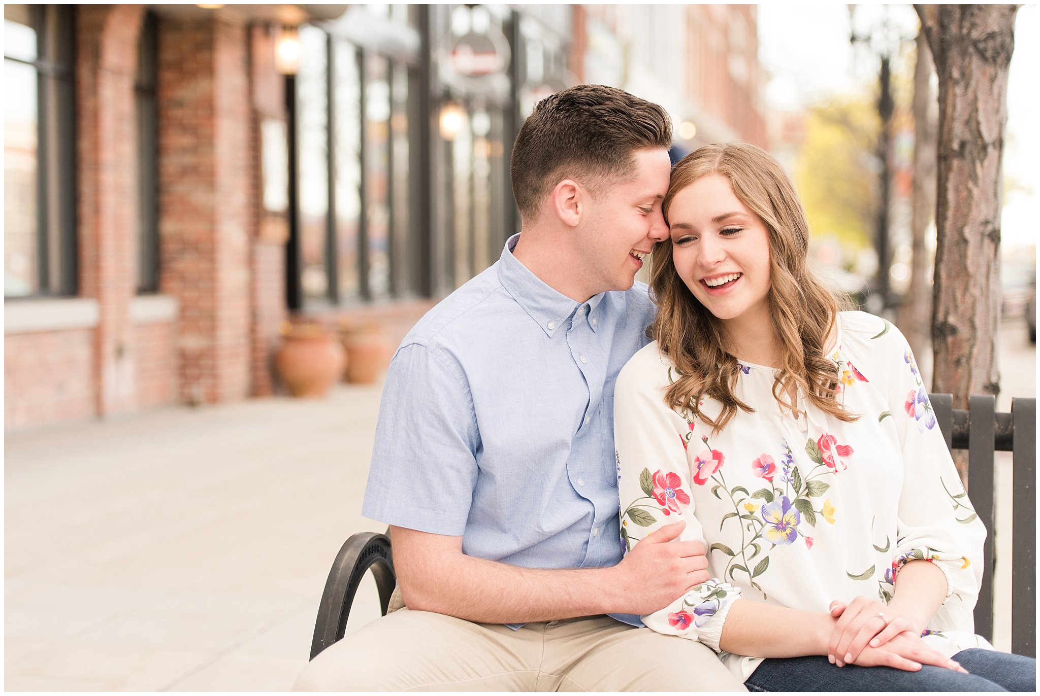 Couple dressed in elegant, light, neutral colors for downtown urban engagement in Logan Utah | Downtown Logan and Wellsville Mountain Engagement | Jessie and Dallin Photography