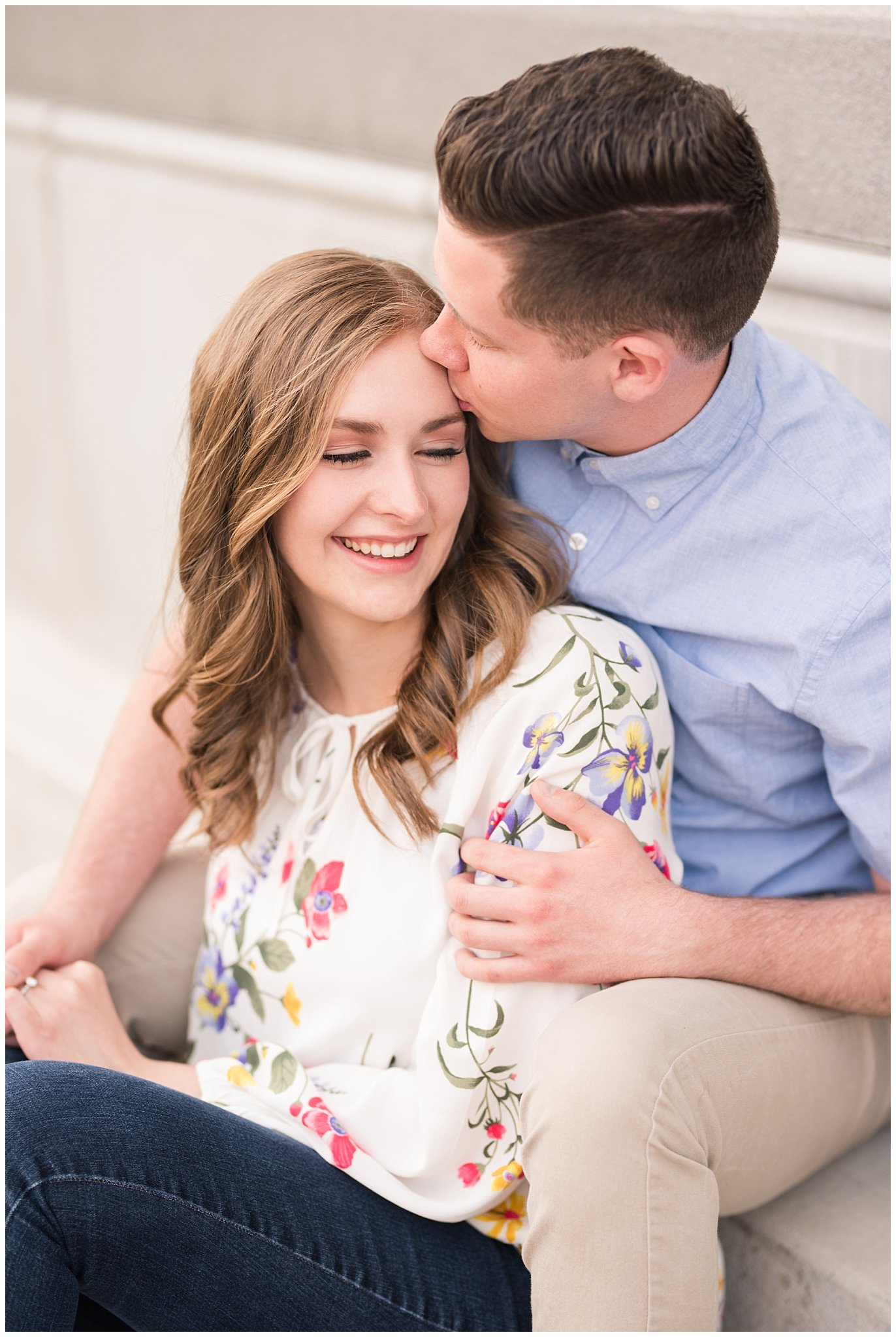 Couple dressed in elegant, light, neutral colors for downtown urban engagement in Logan Utah | Downtown Logan and Wellsville Mountain Engagement | Jessie and Dallin Photography