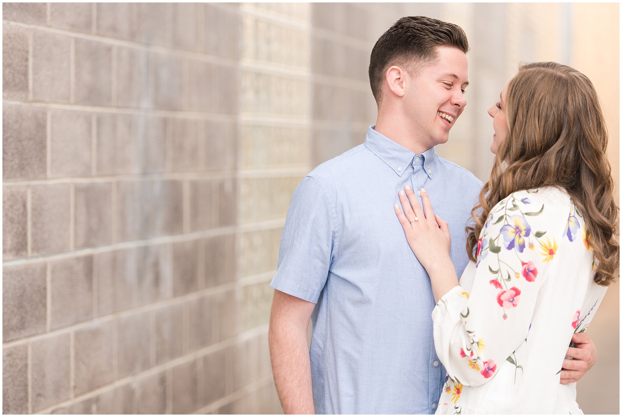 Couple dressed in elegant, light, neutral colors for downtown urban engagement in Logan Utah | Downtown Logan and Wellsville Mountain Engagement | Jessie and Dallin Photography