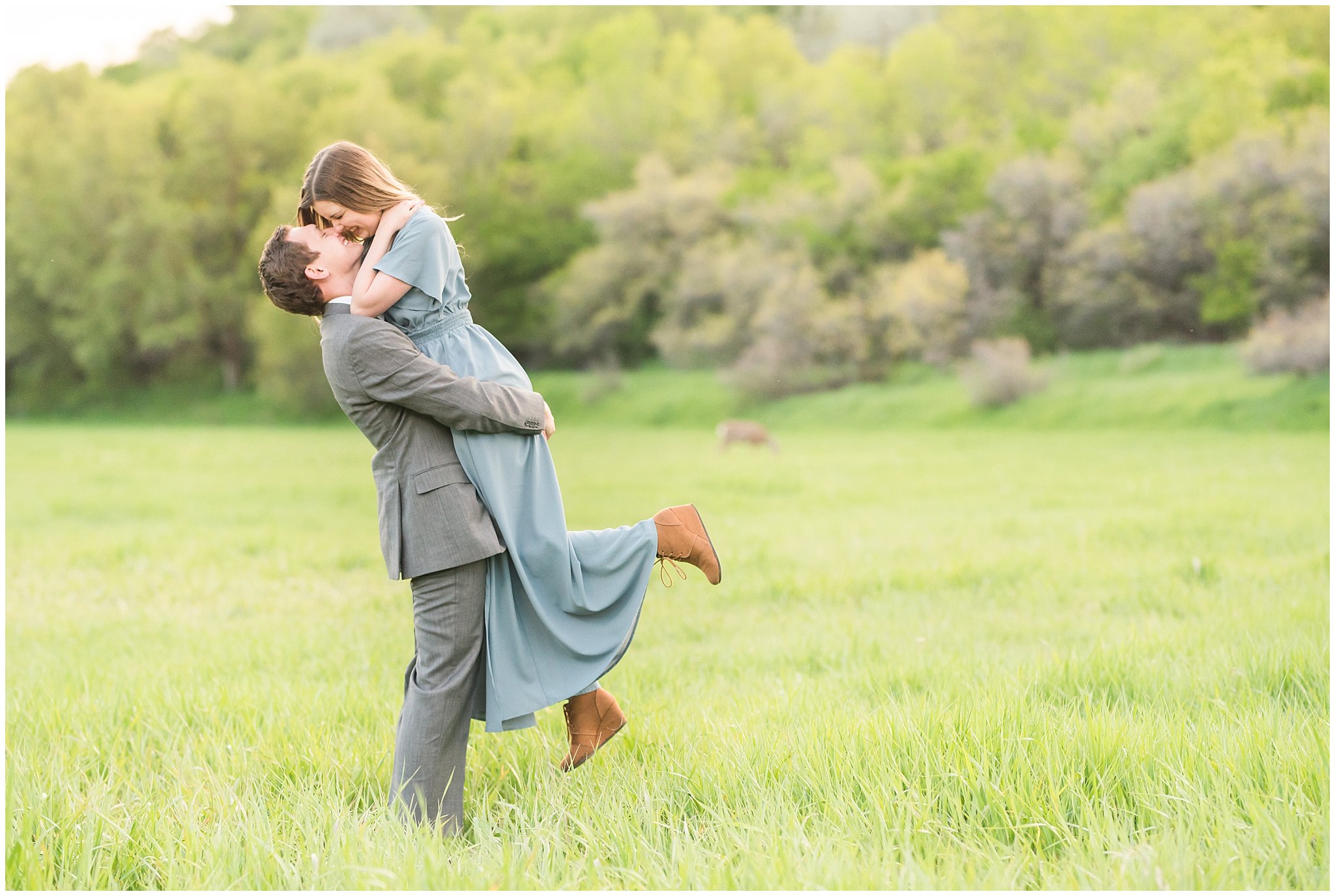 Couple dressed up in flowy blue dress and grey suit for engagement in the woods | Utah Engagement | Jessie and Dallin Photography