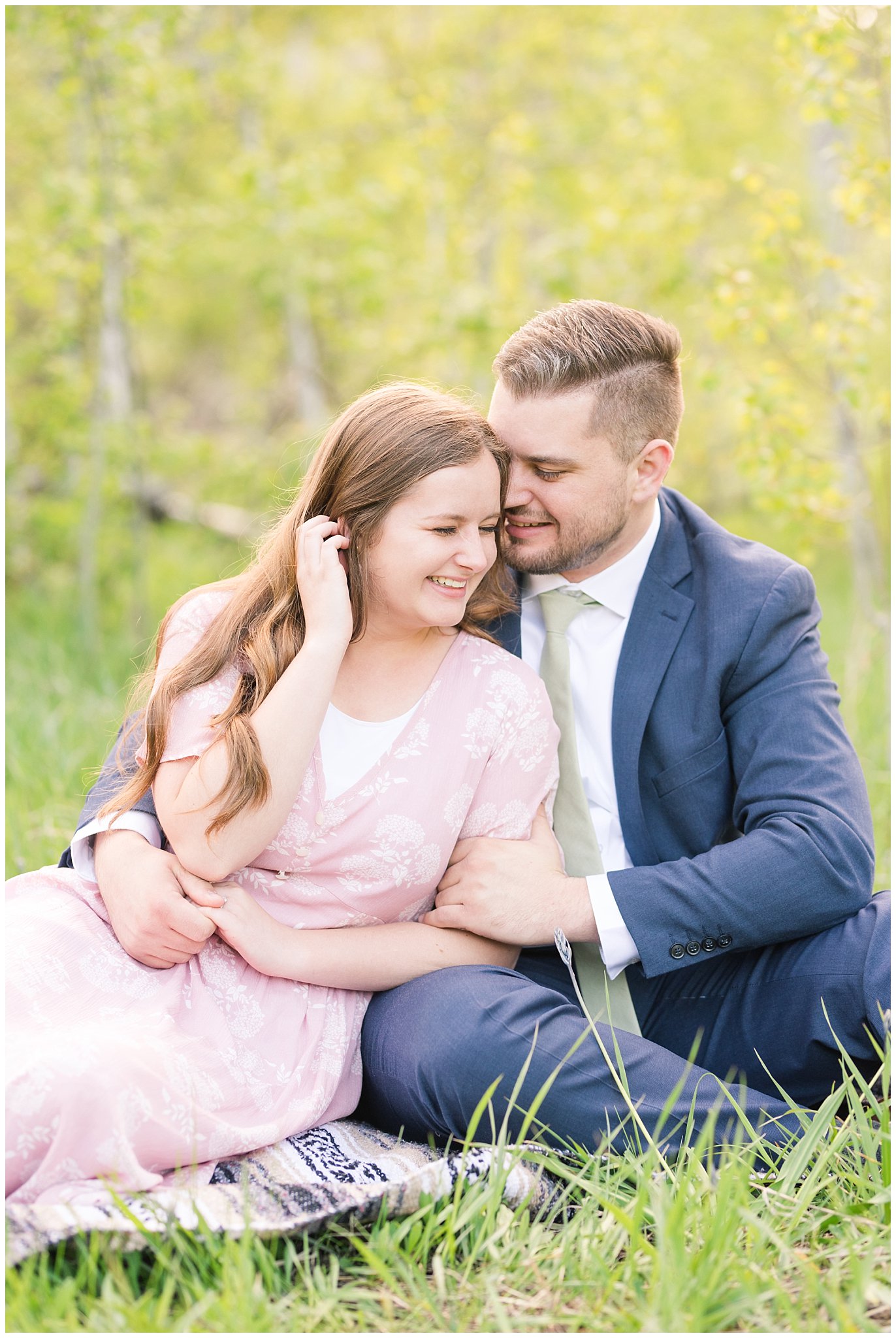 Couple dressed in blush dress and blue suit surrounded meadows and aspen trees | Ogden Valley Spring Mountain Engagement | Jessie and Dallin Photography