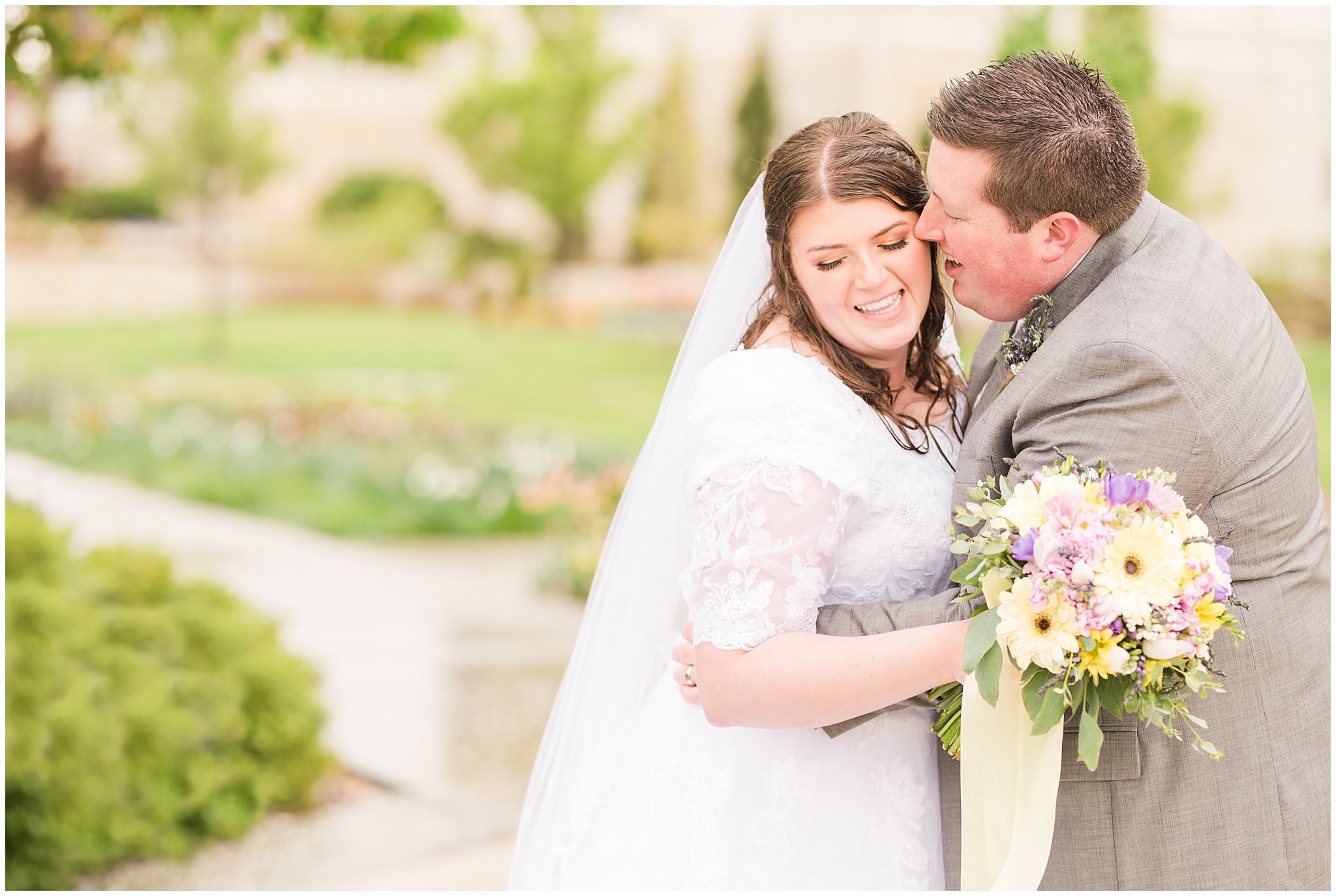 Bride and groom during rainy spring wedding at the Ogden Temple | Utah Wedding | Jessie and Dallin Photography