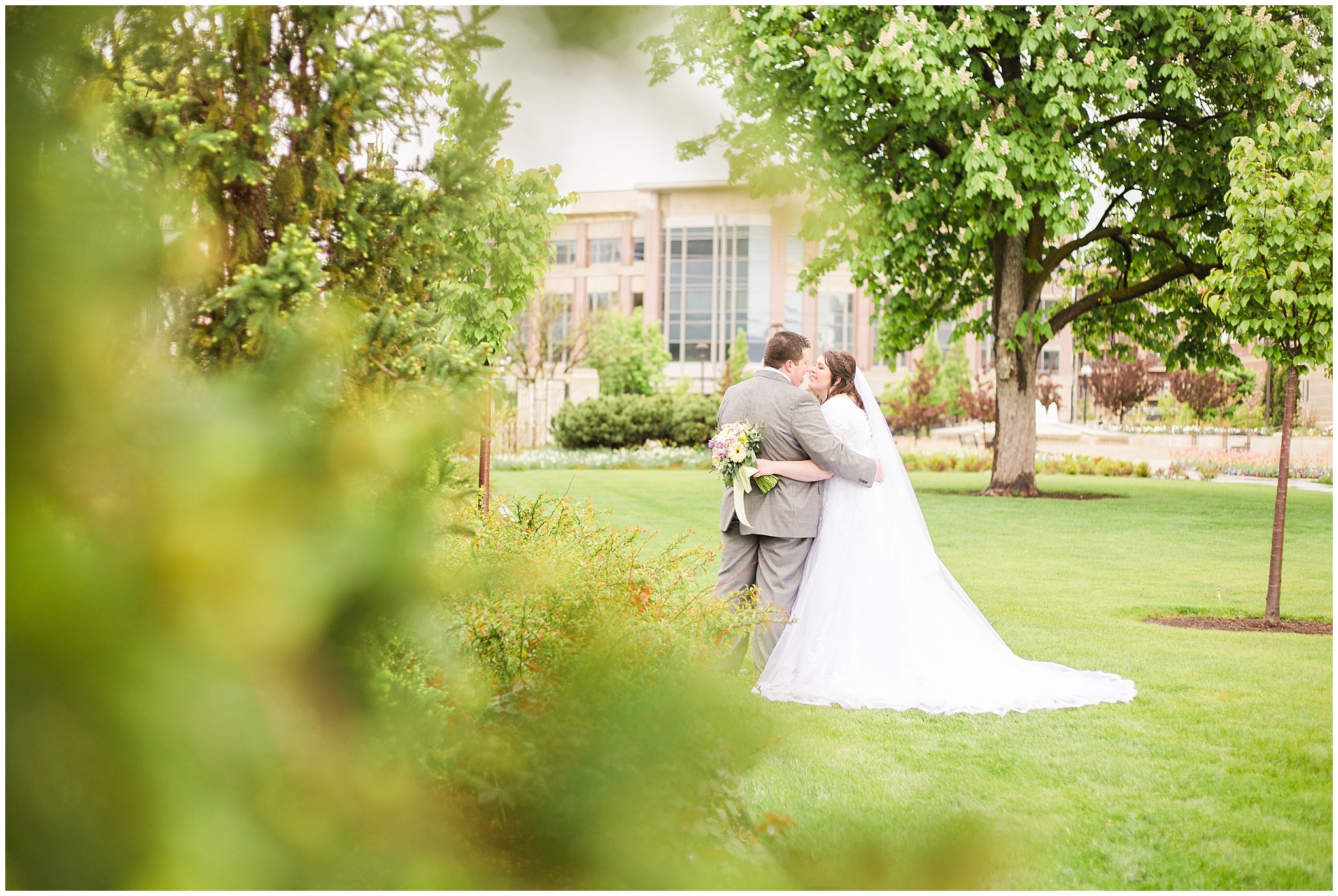 Bride and groom during rainy spring wedding at the Ogden Temple | Utah Wedding | Jessie and Dallin Photography