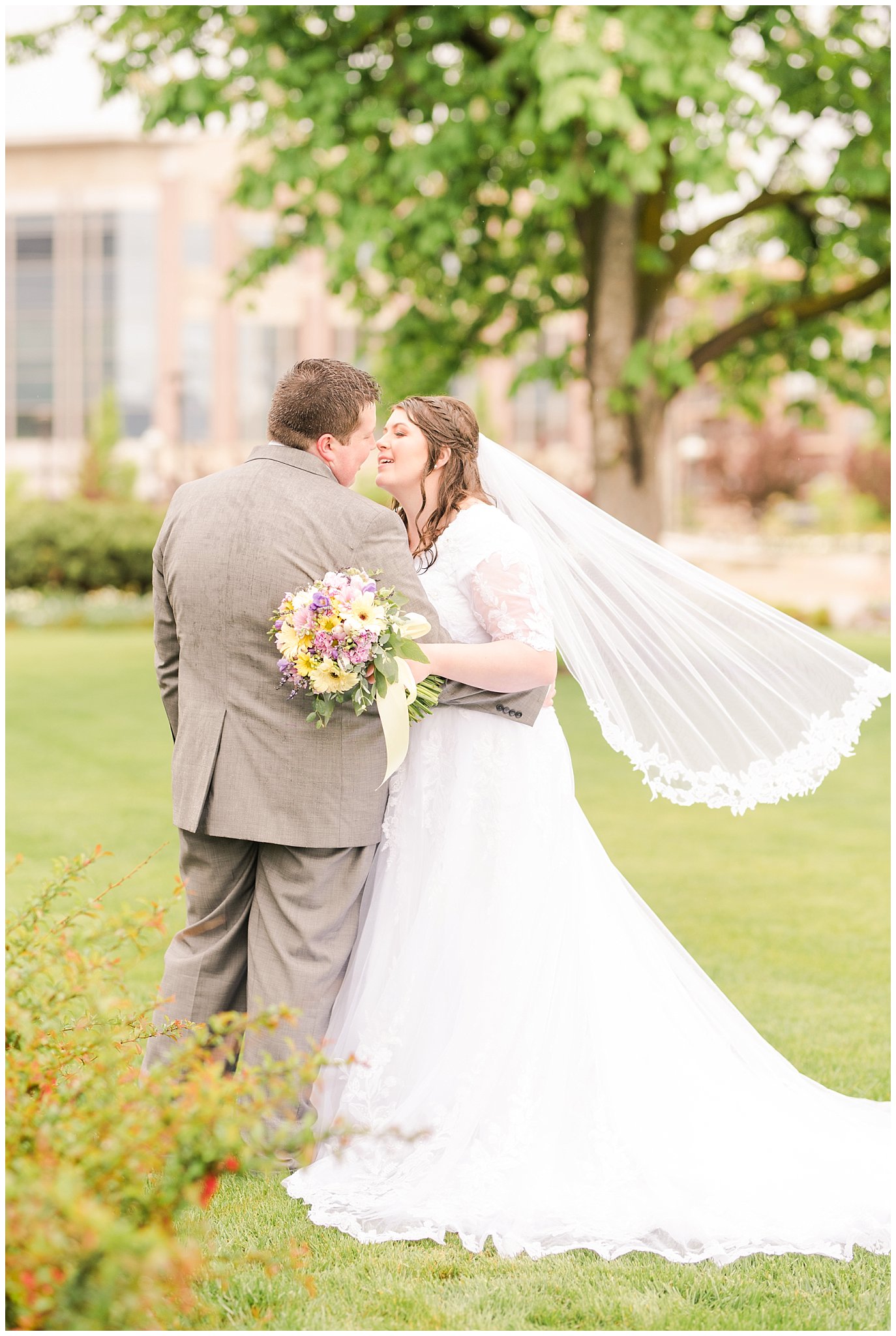 Bride and groom during rainy spring wedding at the Ogden Temple | Utah Wedding | Jessie and Dallin Photography