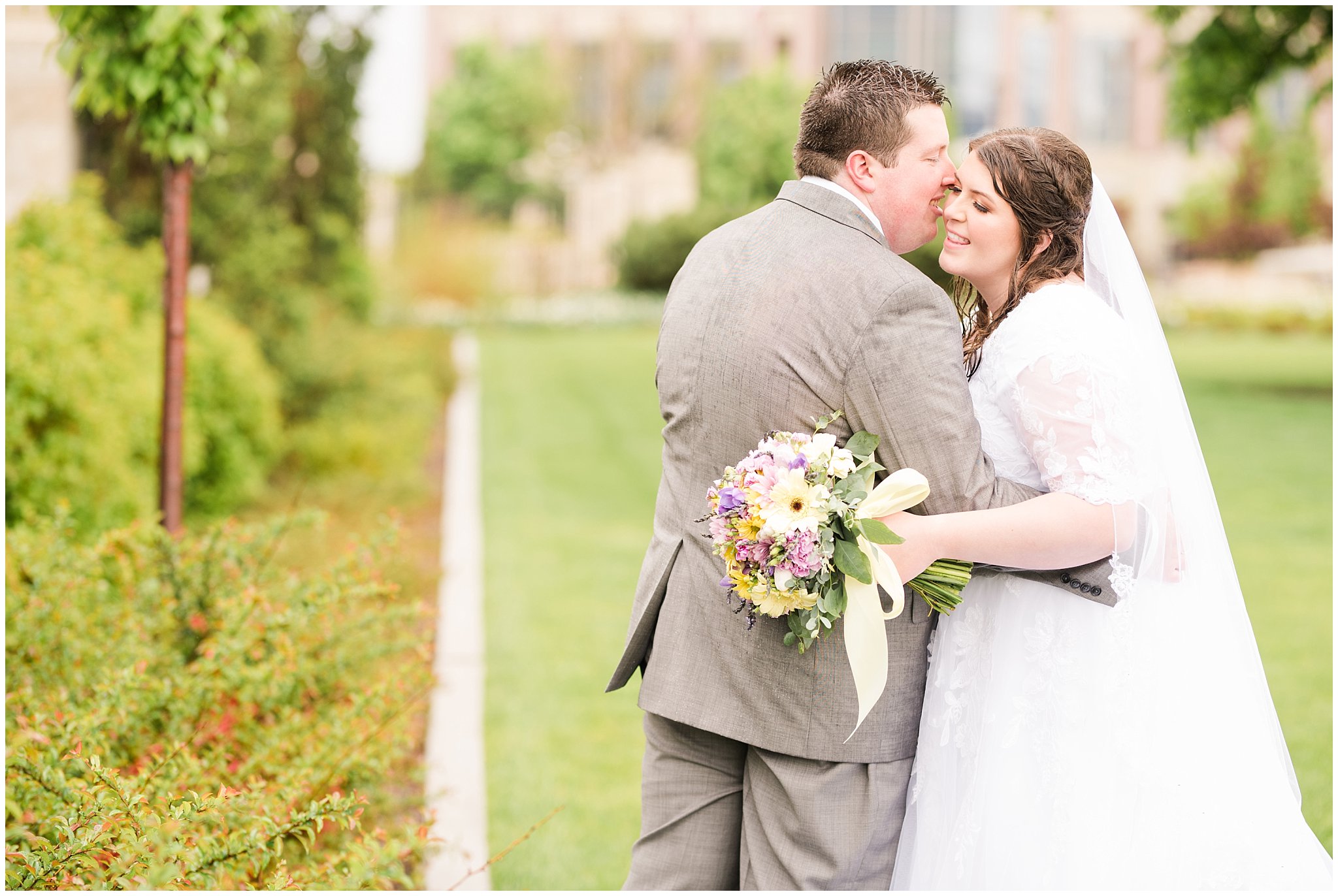 Bride and groom during rainy spring wedding at the Ogden Temple | Utah Wedding | Jessie and Dallin Photography