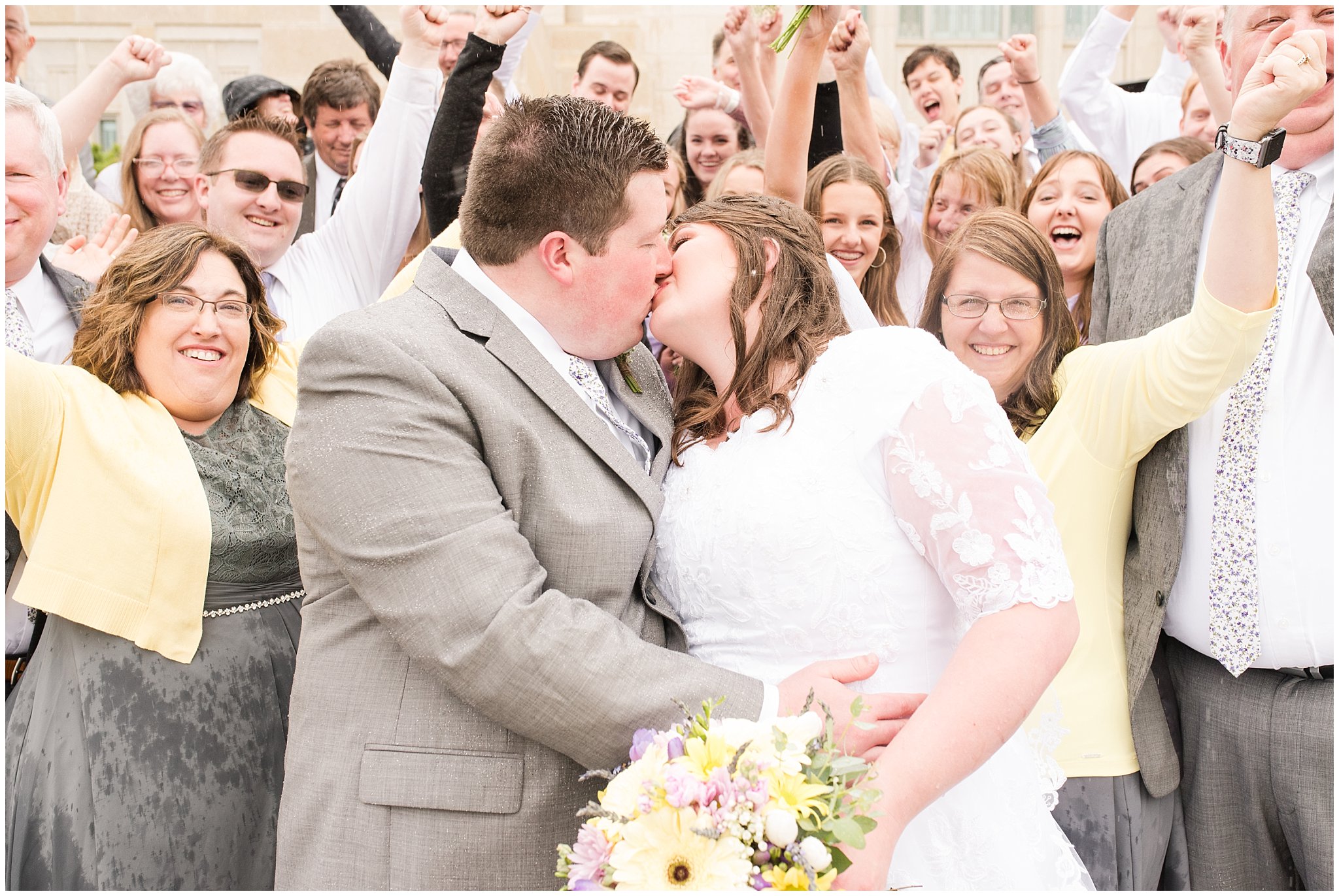 Bride and groom kiss during rainy spring wedding at the Ogden Temple | Utah Wedding | Jessie and Dallin Photography