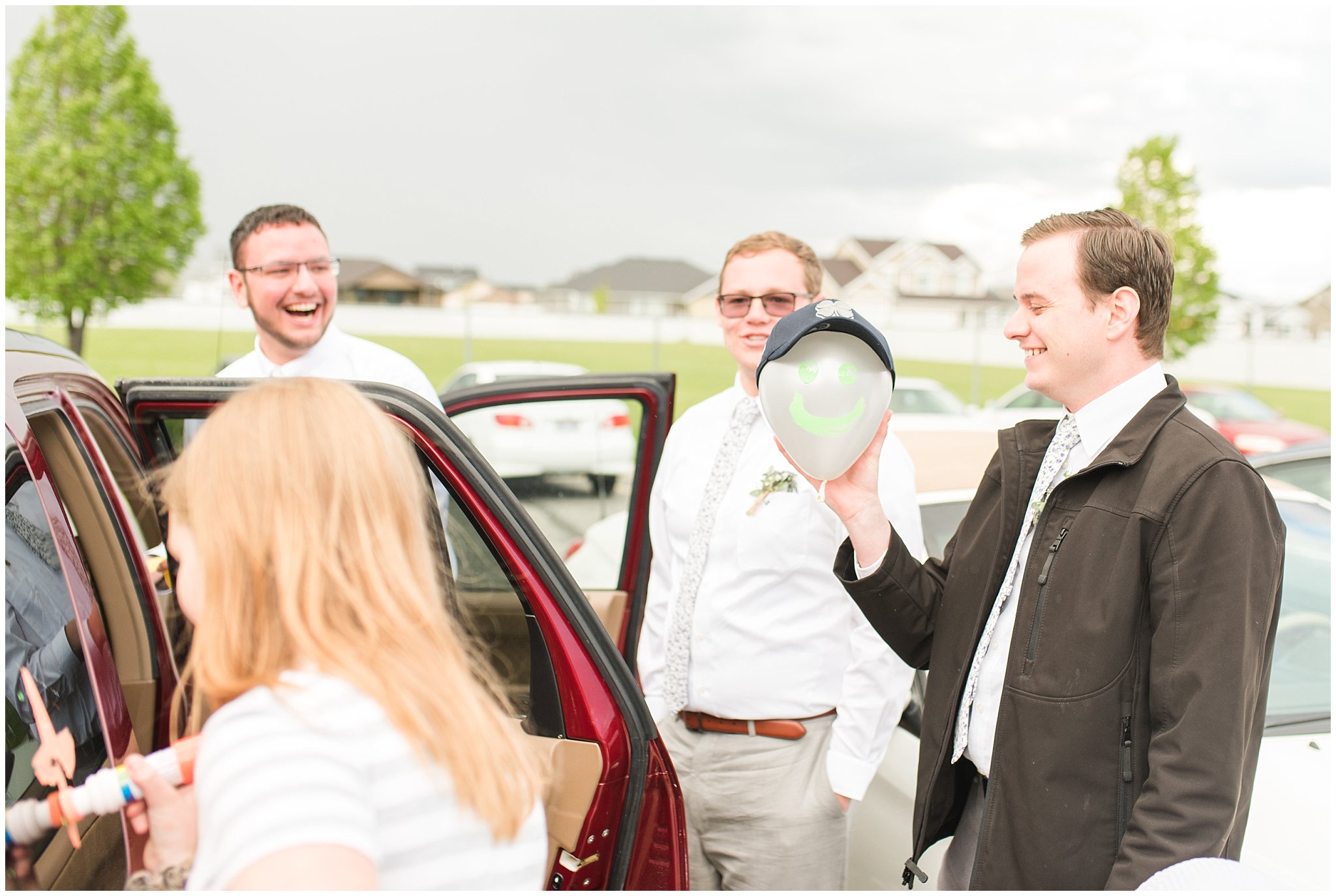 Friends decorating bride and groom's car | Utah Wedding | Jessie and Dallin Photography